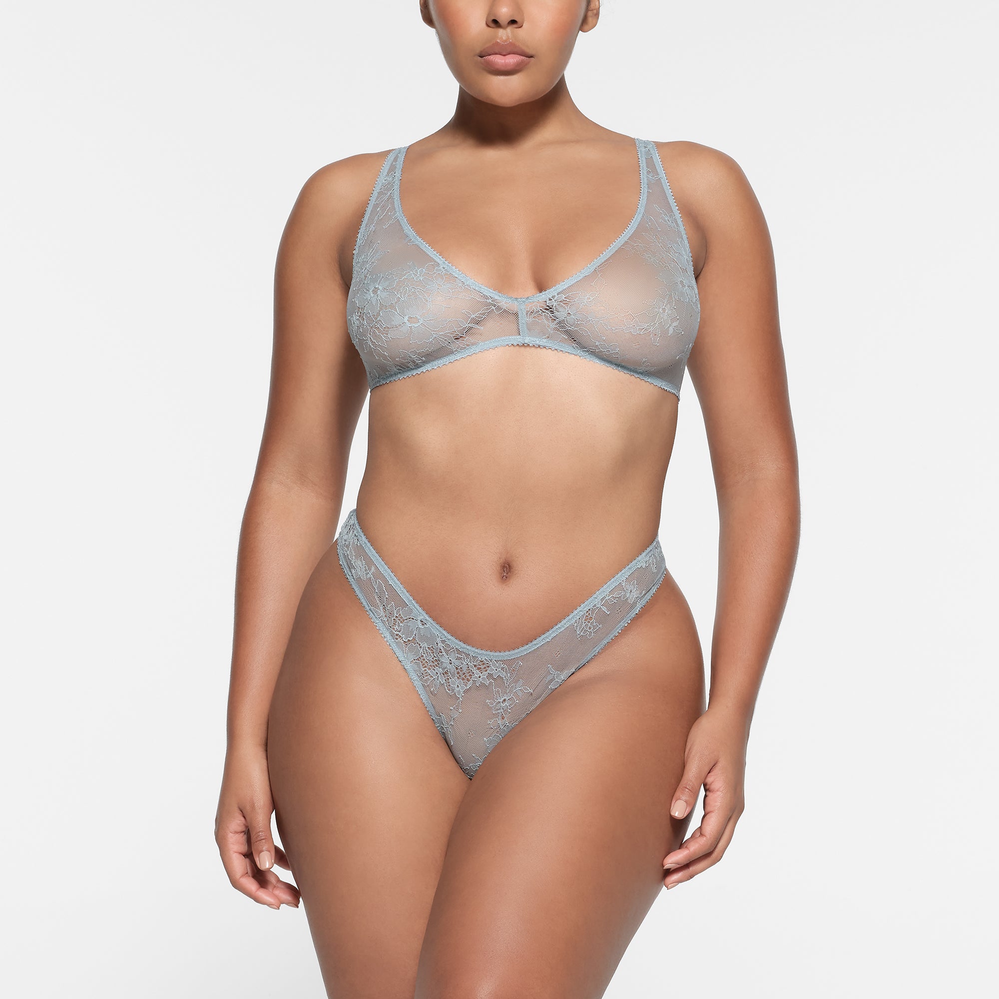 ULTRA FINE LACE PLUNGE BRALETTE | DENIM ON A MODEL FRONT VIEW