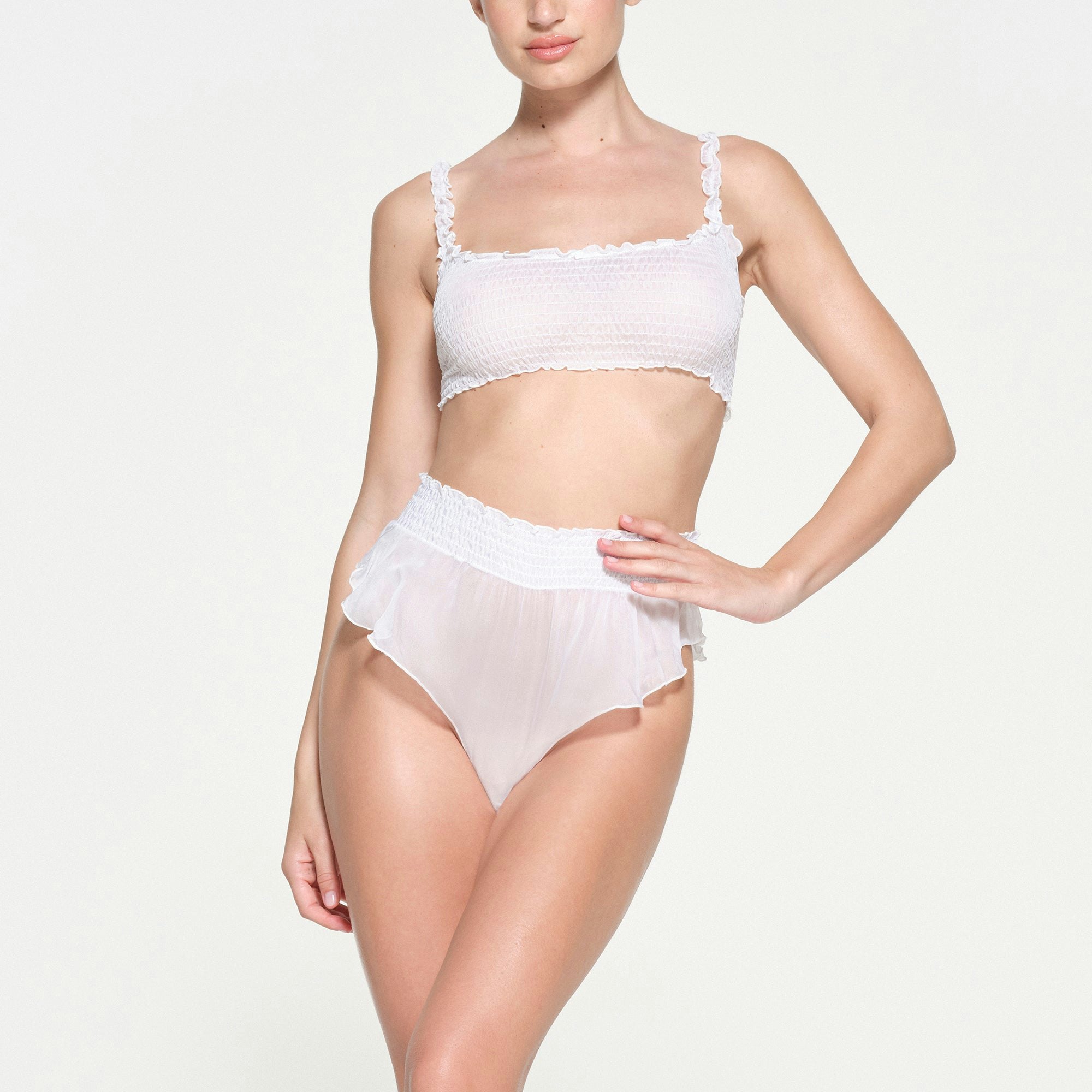 SKIMS ROMANCE SMOCKED BRALETTE | SNOW ON A MODEL FRONT VIEW