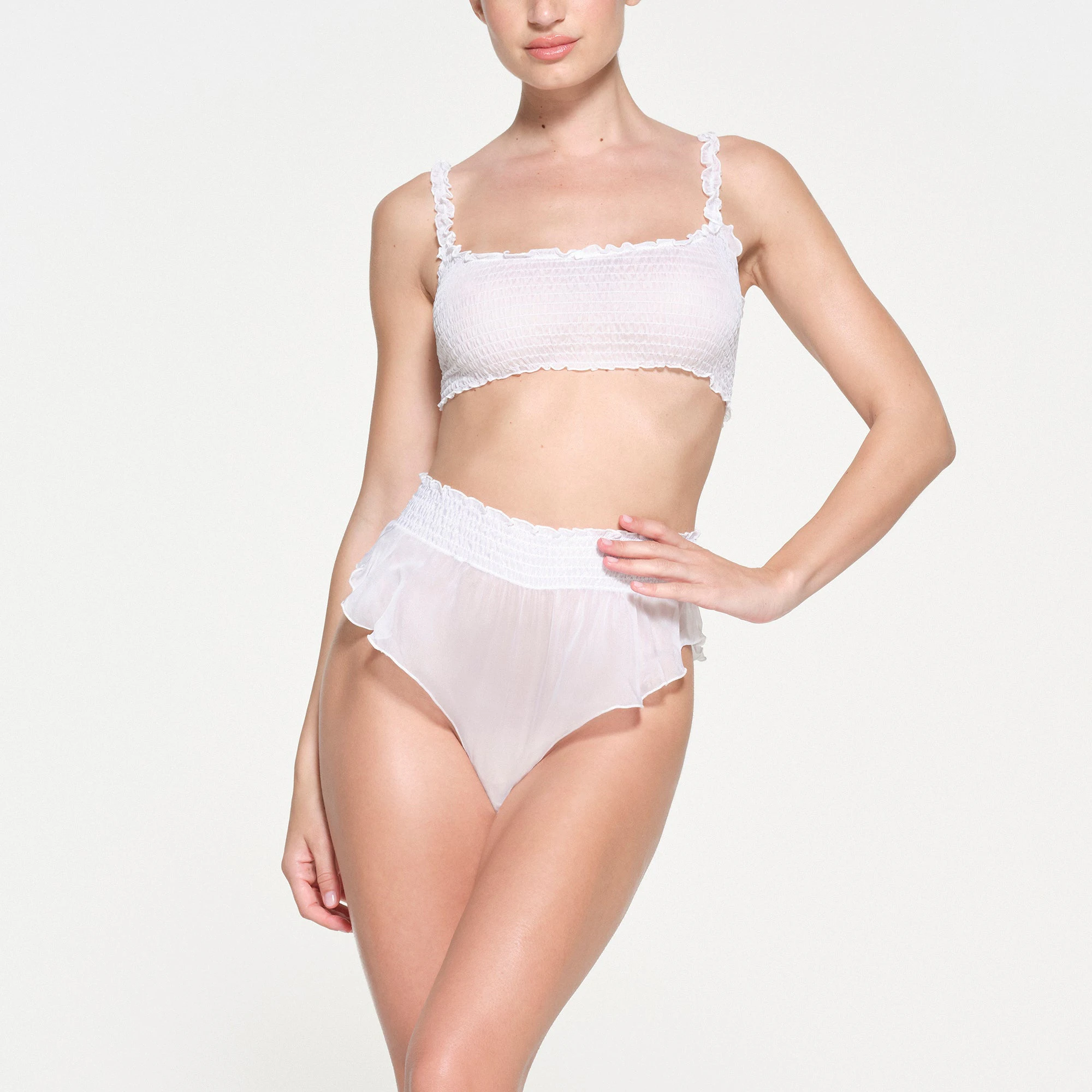 SKIMS ROMANCE SMOCKED BRALETTE | SNOW ON A MODEL FRONT VIEW