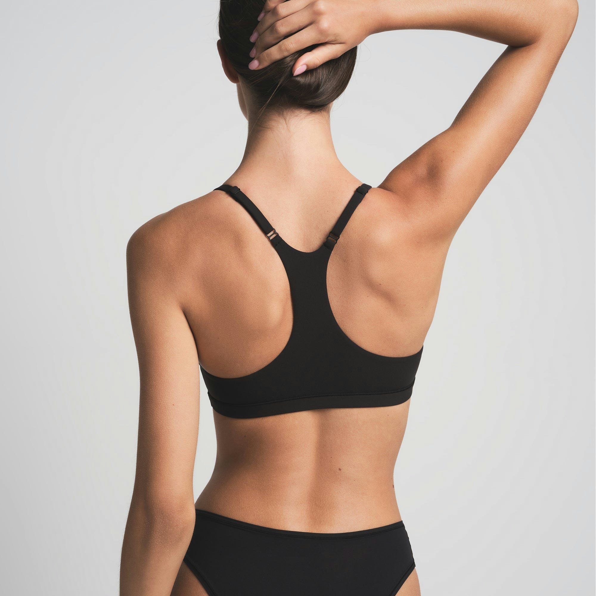 FITS EVERYBODY RACERBACK BRALETTE | ONYX ON A MODEL BACK VIEW | FOCUS: 0.0, 1.0, 0.9