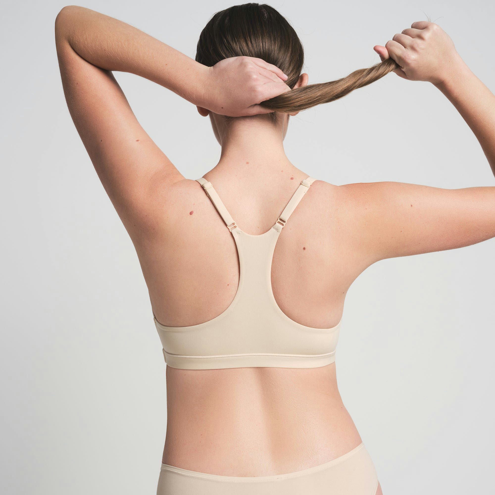 FITS EVERYBODY RACERBACK BRALETTE | SAND ON A MODEL BACK VIEW | FOCUS: 0.0, 1.0, 0.9