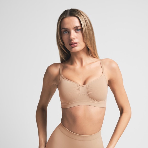 SEAMLESS SCULPT BRALETTE | CLAY ON A MODEL FRONT VIEW