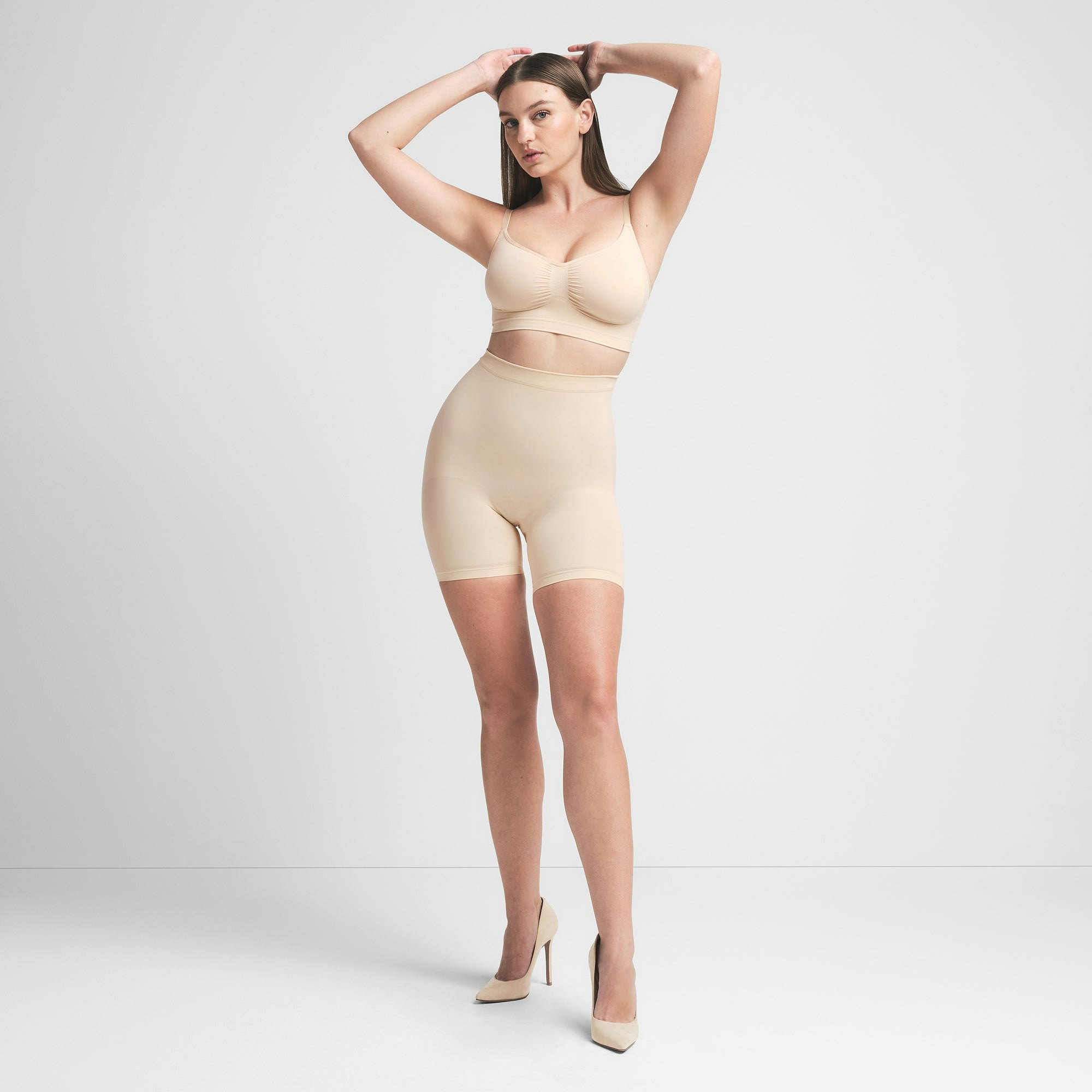 SEAMLESS SCULPT BRALETTE | SAND ON A MODEL FRONT VIEW | FOCUS: 0.0, 1.0, 0.9