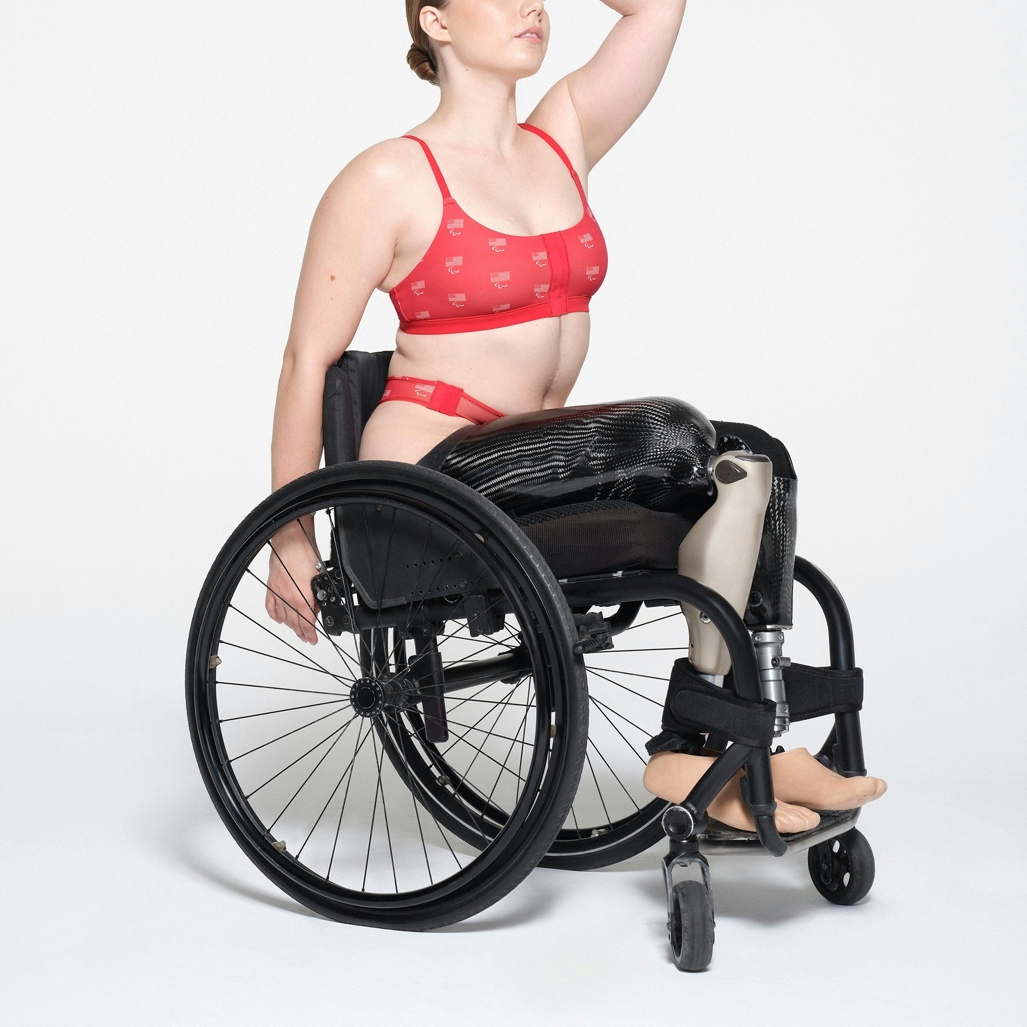 SKIMS FOR TEAM USA FITS EVERYBODY ADAPTIVE PARALYMPIC SCOOP BRALETTE | RED ON A MODEL SIDE VIEW