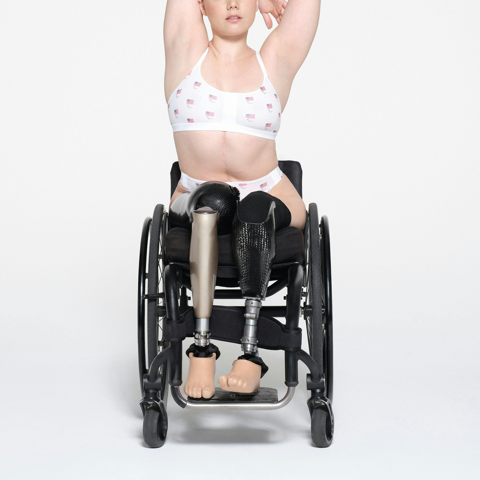 SKIMS FOR TEAM USA FITS EVERYBODY ADAPTIVE PARALYMPIC SCOOP BRALETTE | WHITE ON A MODEL FRONT VIEW | FOCUS: 0.1, 1, 0.9