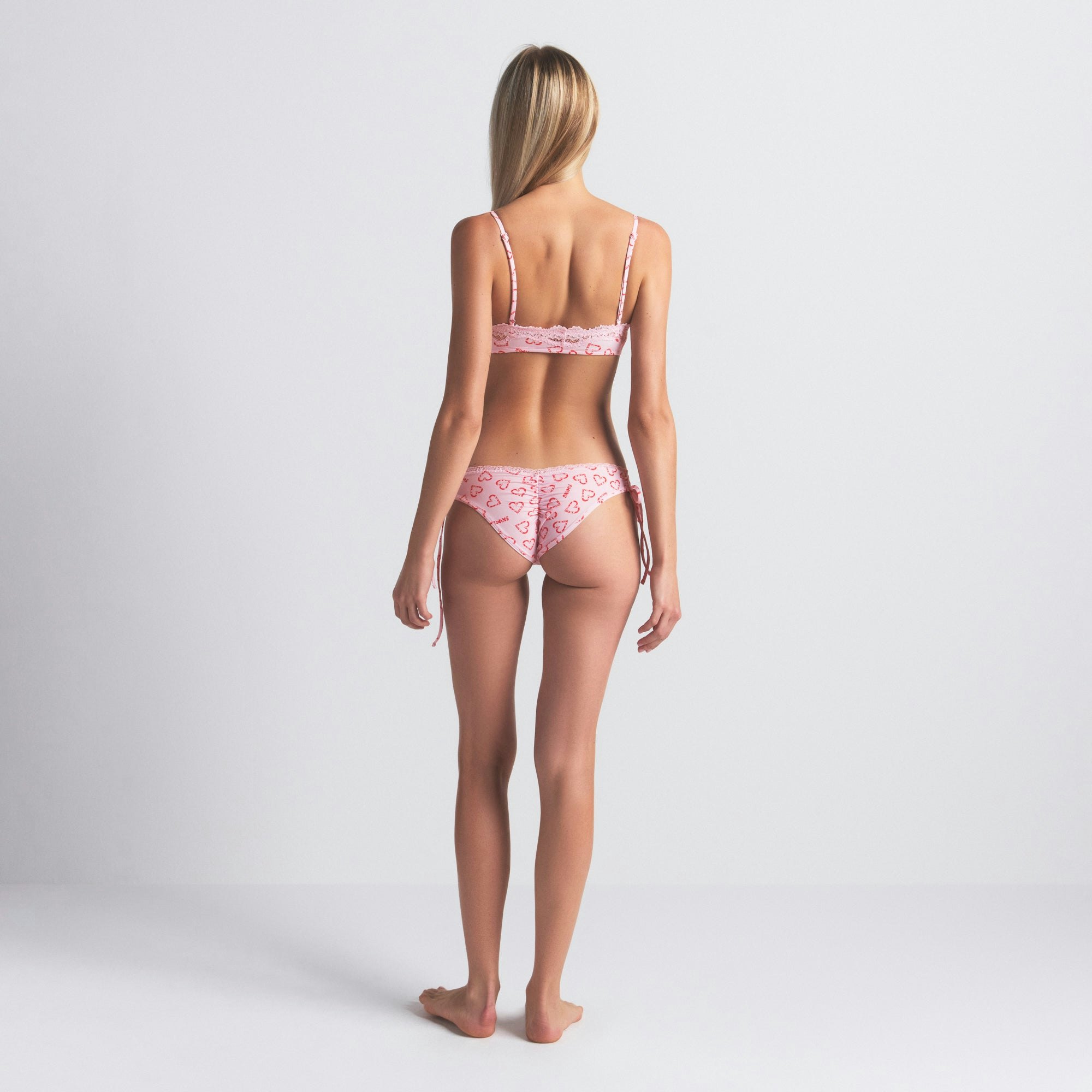 FITS EVERYBODY LACE SCOOP BRALETTE | CHERRY BLOSSOM CANDY HEART PRINT ON A MODEL SIDE VIEW @ | FOCUS: 0.0, 1.0, 0.9