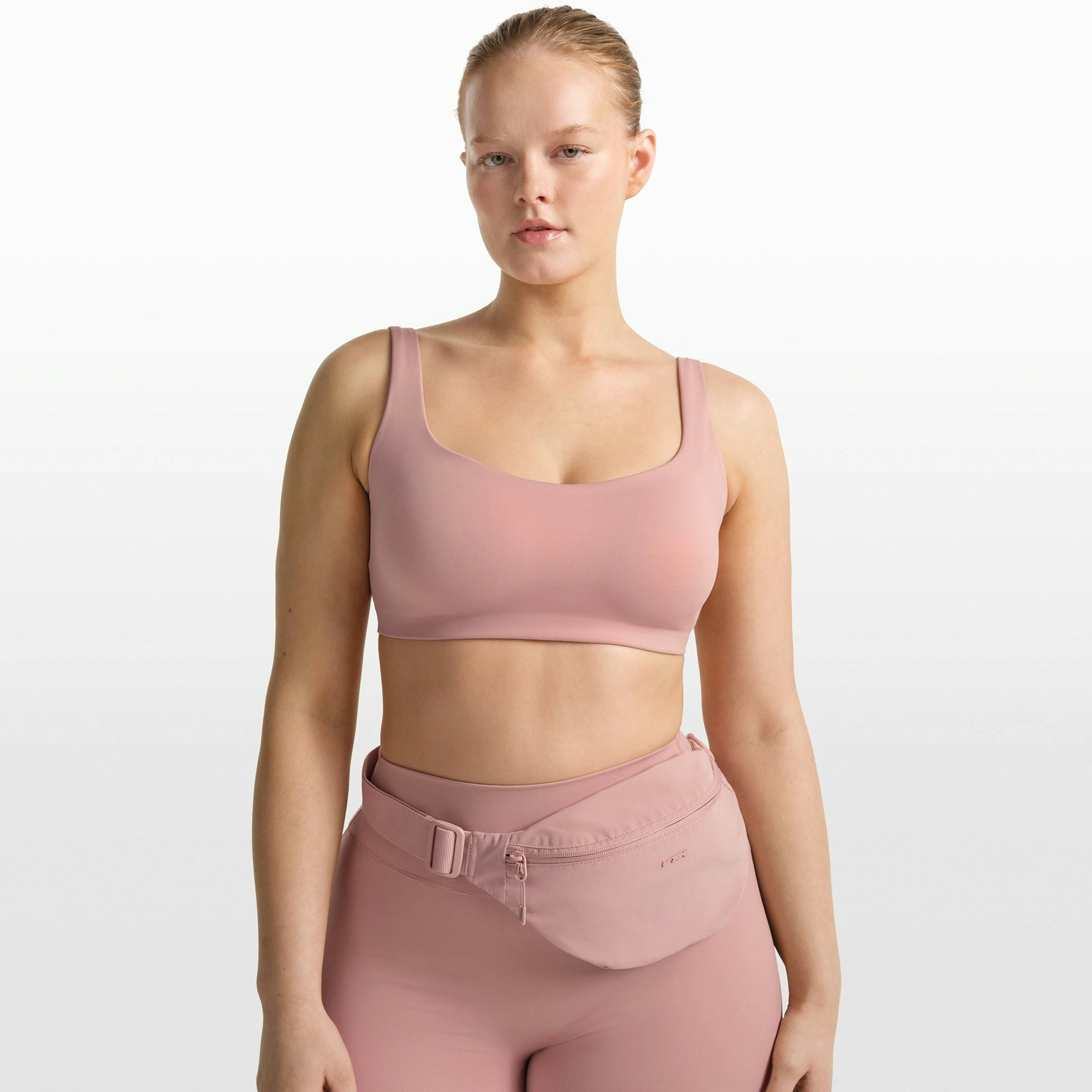 NikeSKIMS MATTE SCOOP NECK BRA | HIMALAYAN ON A MODEL FRONT VIEW @ | FOCUS: 0.0, 1.0, 0.9