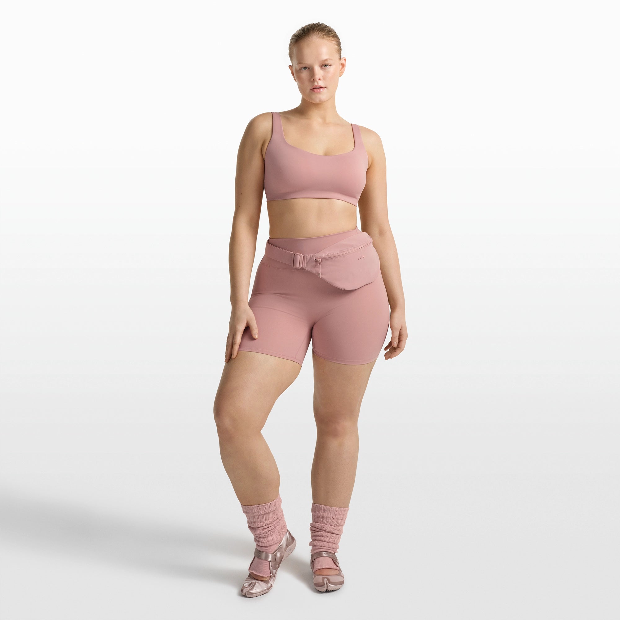 NikeSKIMS MATTE SCOOP NECK BRA | HIMALAYAN ON A MODEL FRONT VIEW @ | FOCUS: 0.0, 1.0, 0.9