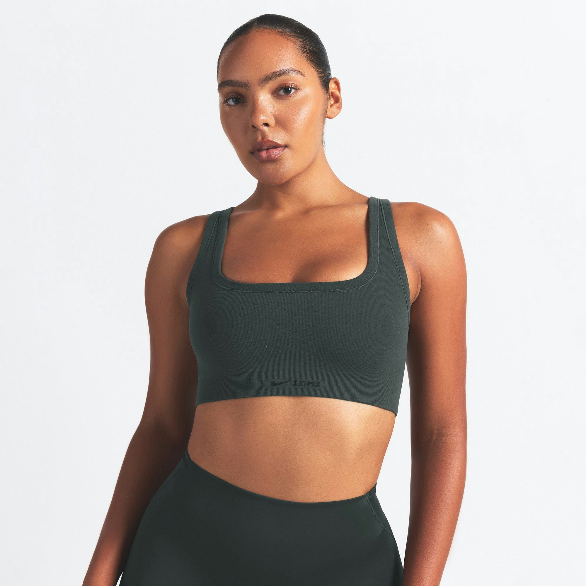 NikeSKIMS VINTAGE SEAMLESS SCOOP NECK BRA | DARK TEAL ON A MODEL SIDE VIEW @ | FOCUS: 0.0, 1.0, 0.9