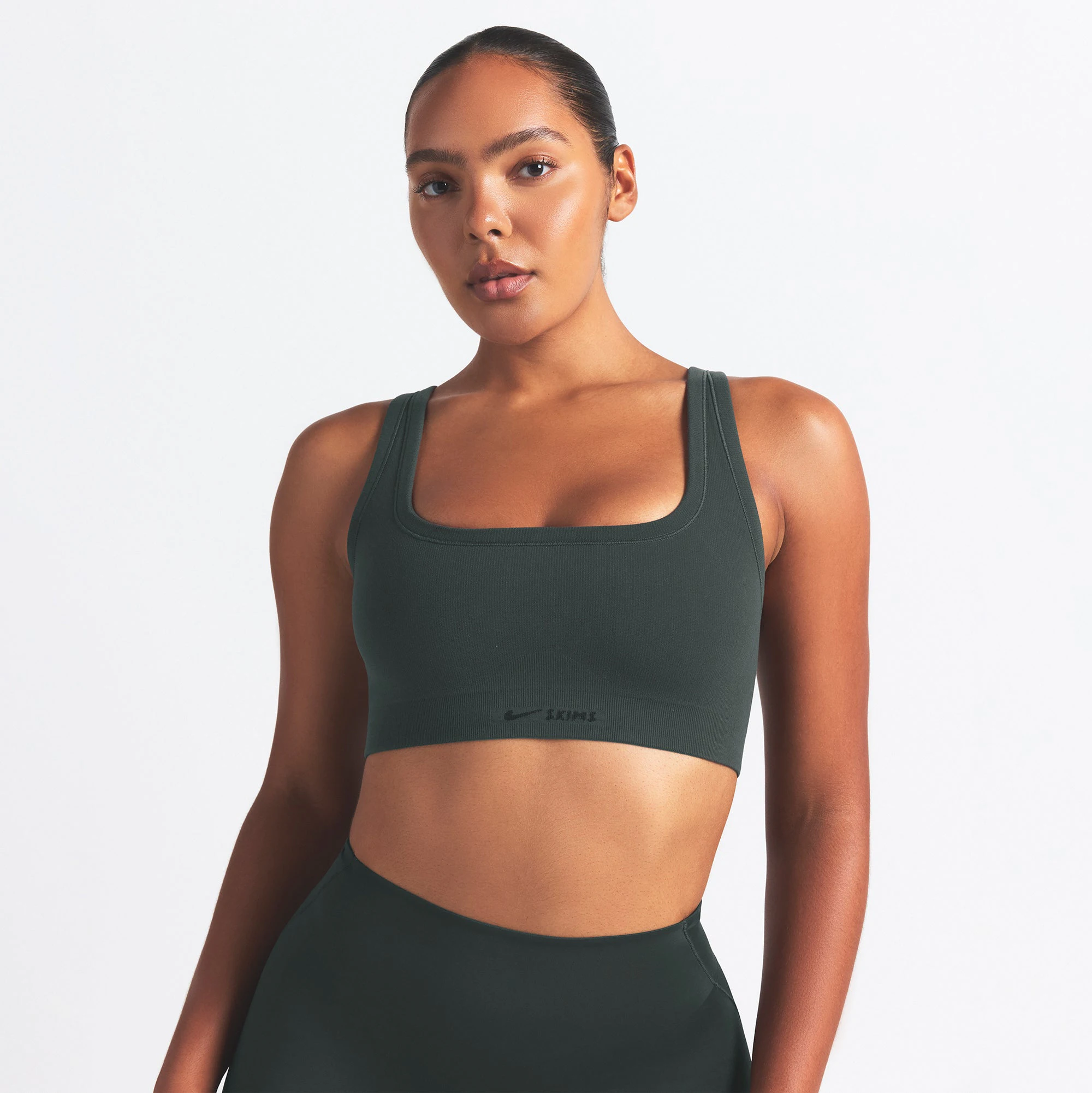 NikeSKIMS VINTAGE SEAMLESS SCOOP NECK BRA | DARK TEAL ON A MODEL SIDE VIEW @ | FOCUS: 0.0, 1.0, 0.9