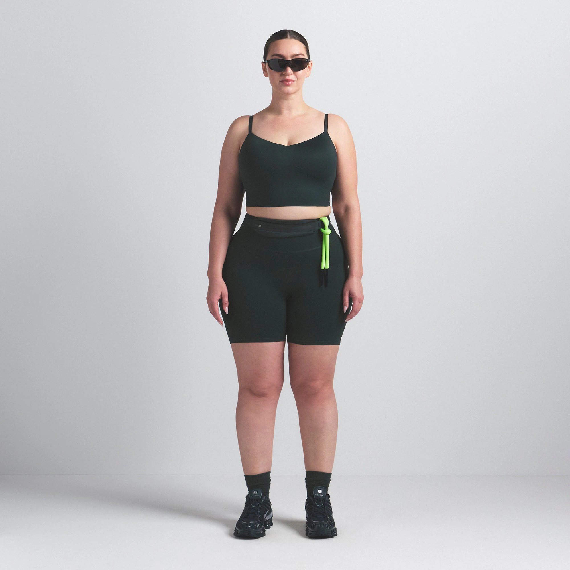 NikeSKIMS MATTE CAMI BRA TOP | DARK TEAL ON A MODEL FRONT VIEW @ | FOCUS: 0.0, 1.0, 0.9