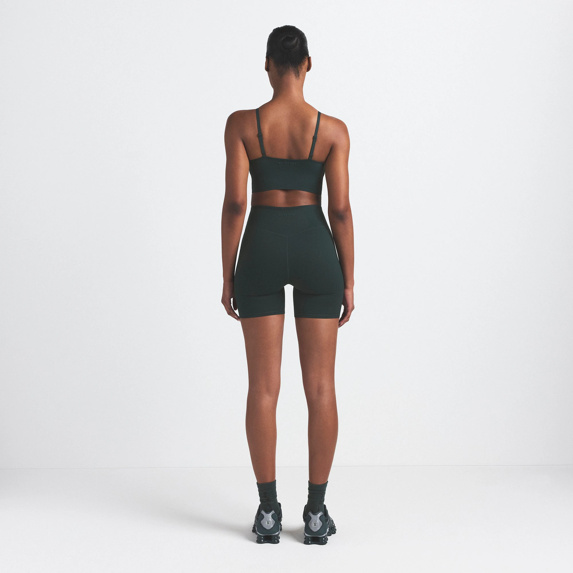 NikeSKIMS MATTE CAMI BRA TOP | DARK TEAL ON A MODEL SIDE VIEW @ | FOCUS: 0.0, 1.0, 0.9