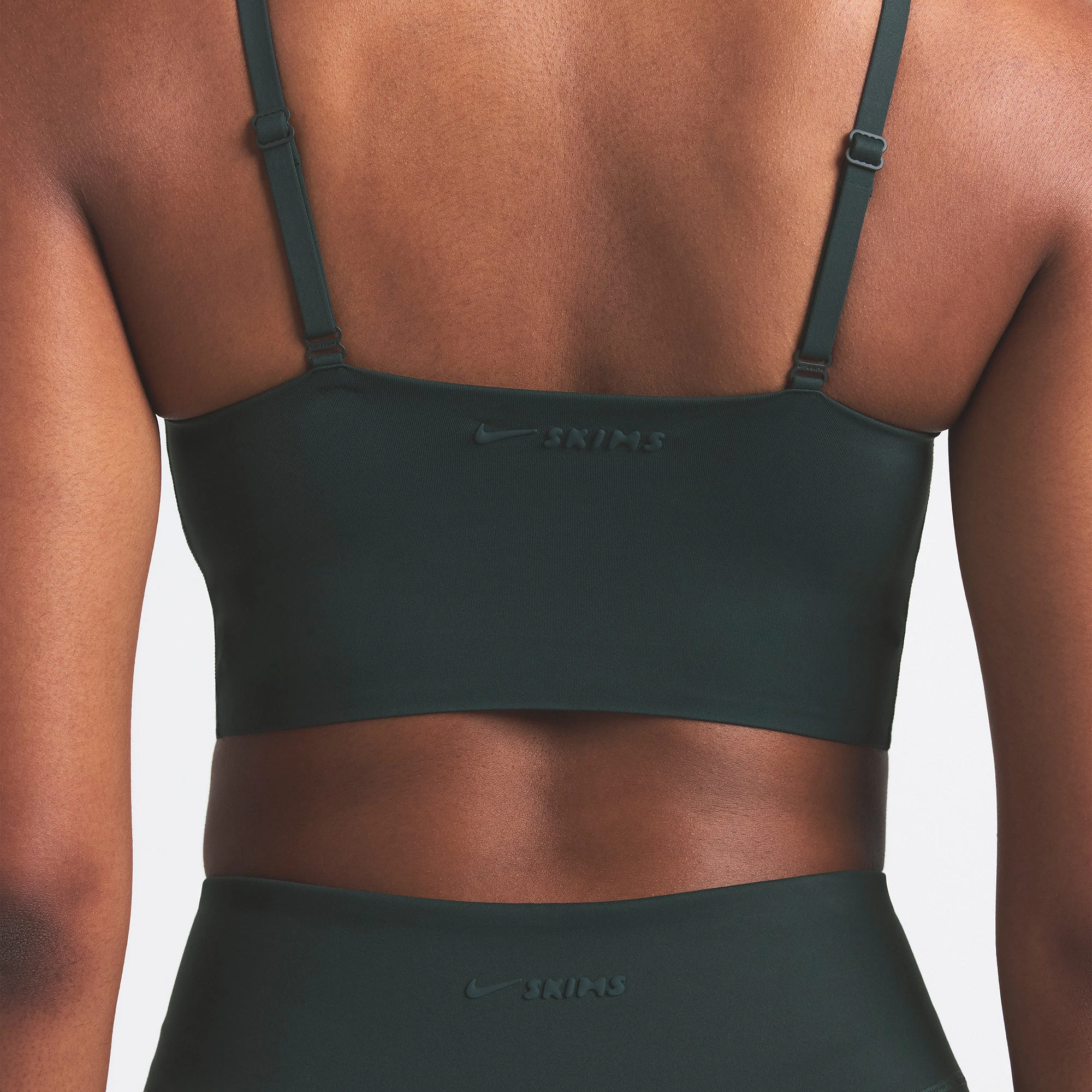 NikeSKIMS MATTE CAMI BRA TOP | DARK TEAL ON A MODEL SIDE VIEW @ | FOCUS: 0.0, 1.0, 0.9