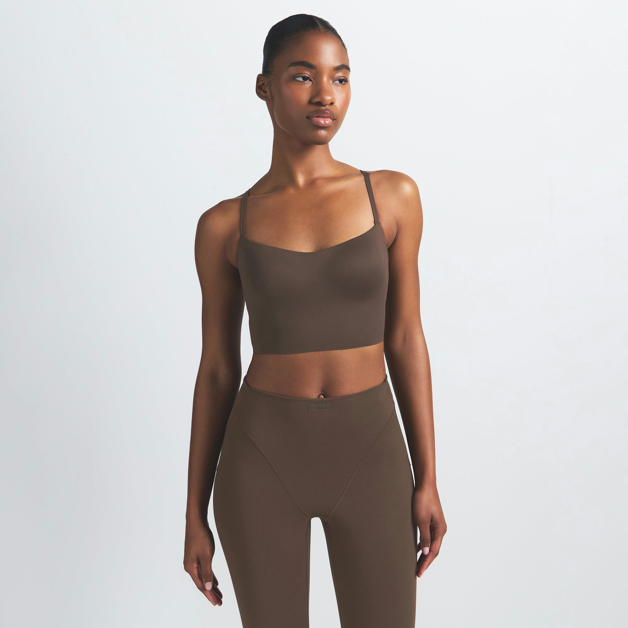 NikeSKIMS MATTE CAMI BRA TOP | DARK SEPIA ON A MODEL FRONT VIEW @ | FOCUS: 0.9, 0.1, 0.7