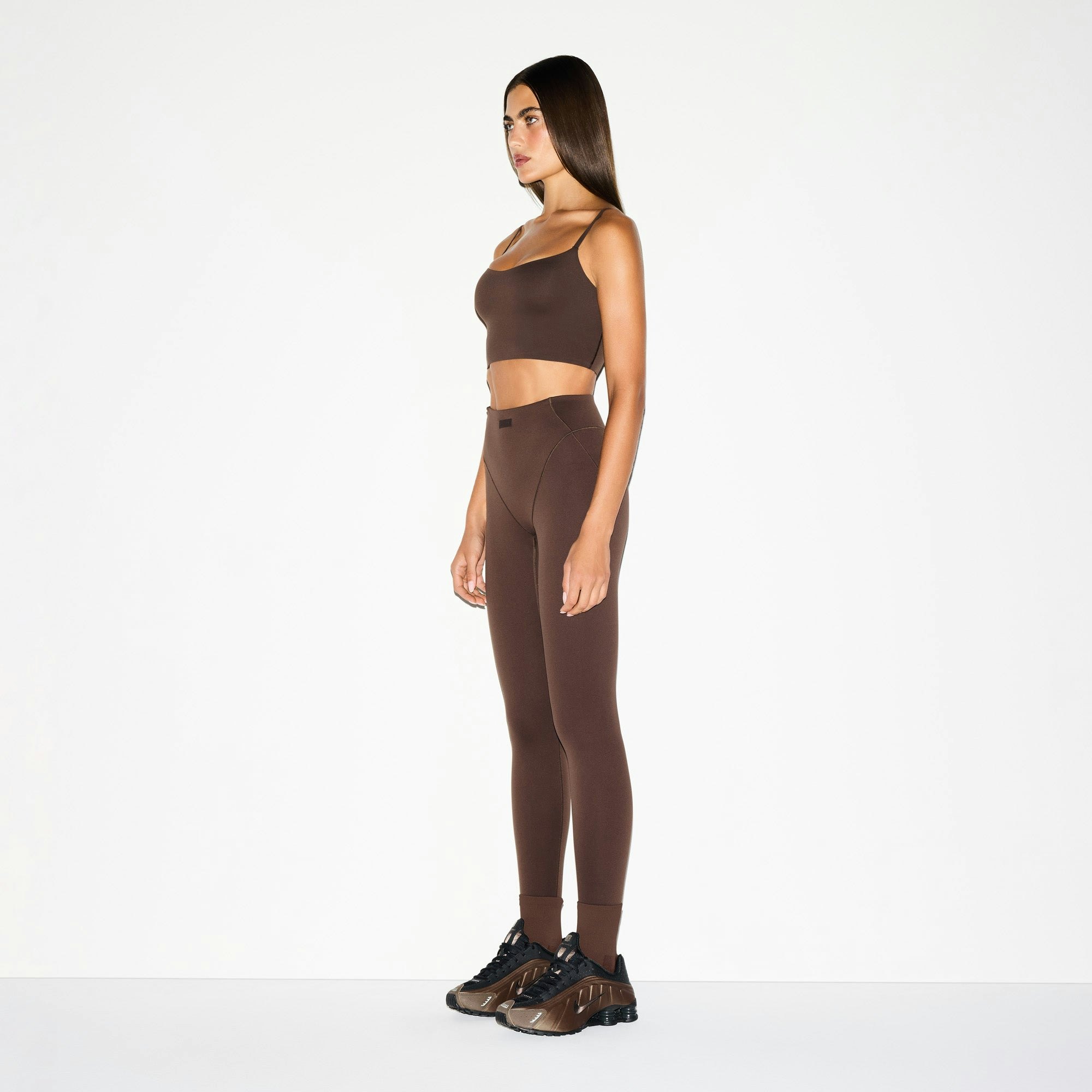 NikeSKIMS MATTE CAMI BRA TOP | DARK SEPIA ON A MODEL SIDE VIEW @ | FOCUS: 0.0, 1.0, 0.9