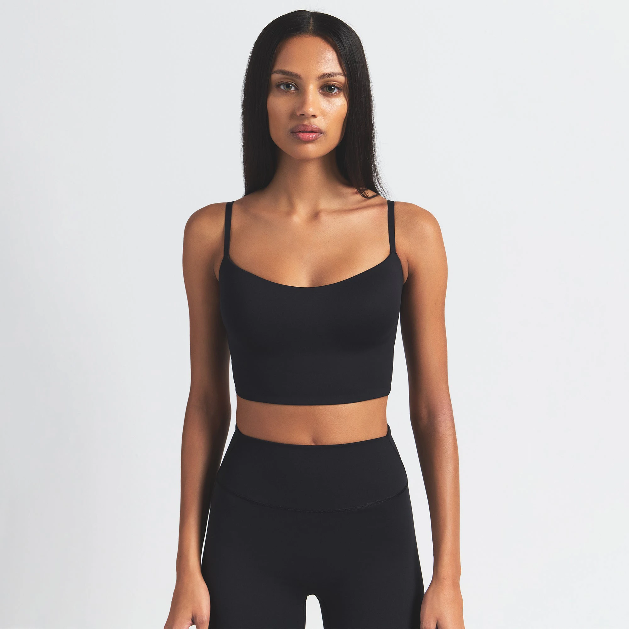NikeSKIMS MATTE CAMI BRA TOP | OBSIDIAN ON A MODEL FRONT VIEW