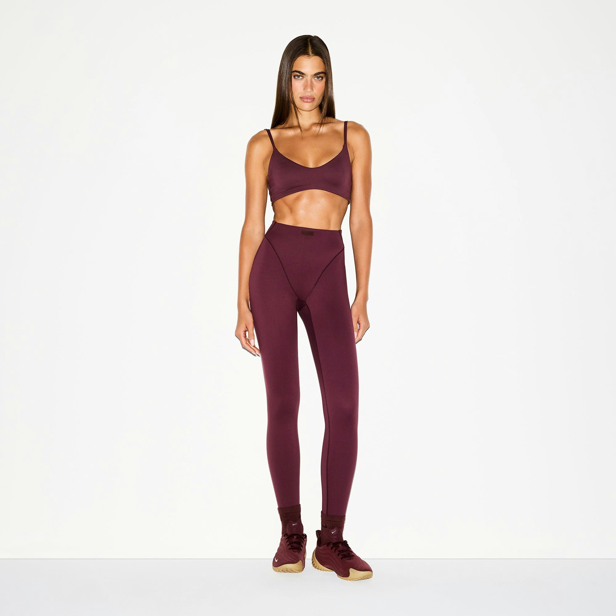 NikeSKIMS MATTE MICRO SCOOP BRA | CURRANT ON A MODEL FRONT VIEW @ | FOCUS: 0.0, 1.0, 0.9