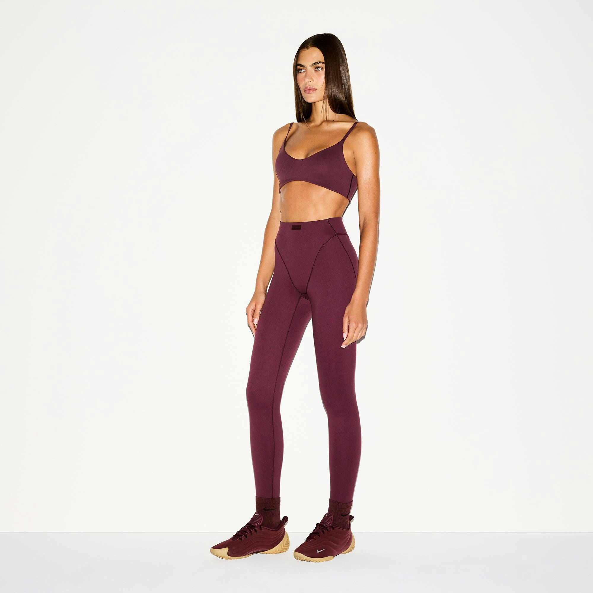 NikeSKIMS MATTE MICRO SCOOP BRA | CURRANT ON A MODEL SIDE VIEW @ | FOCUS: 0.0, 1.0, 0.9