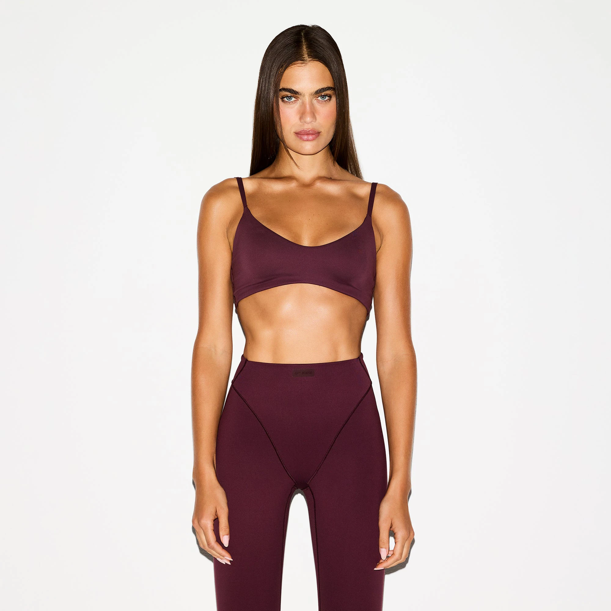 NikeSKIMS MATTE MICRO SCOOP BRA | CURRANT ON A MODEL FRONT VIEW @ | FOCUS: 0.0, 1.0, 0.9