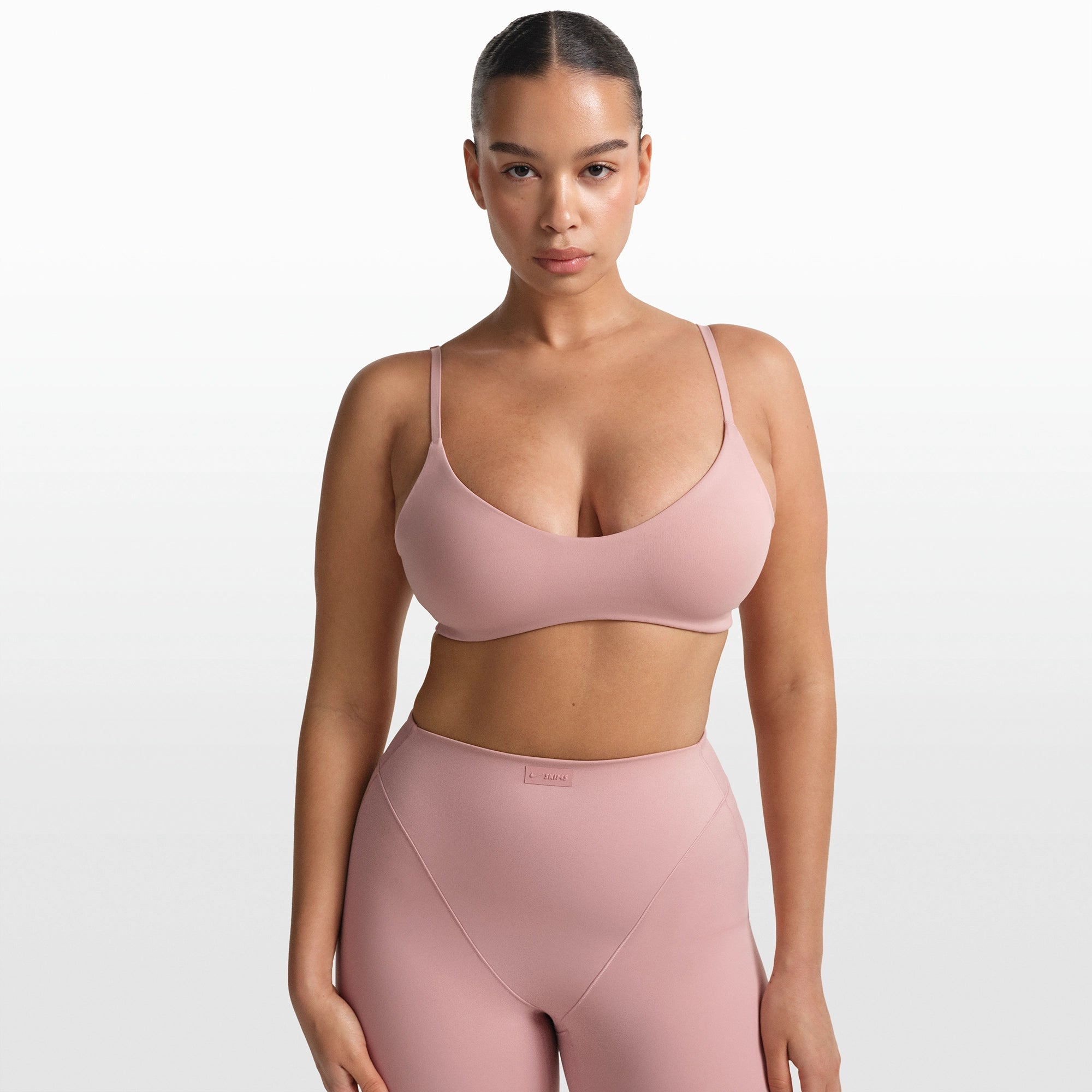 NikeSKIMS MATTE MICRO SCOOP BRA | HIMALAYAN ON A MODEL FRONT VIEW @ | FOCUS: 0.0, 1.0, 0.9