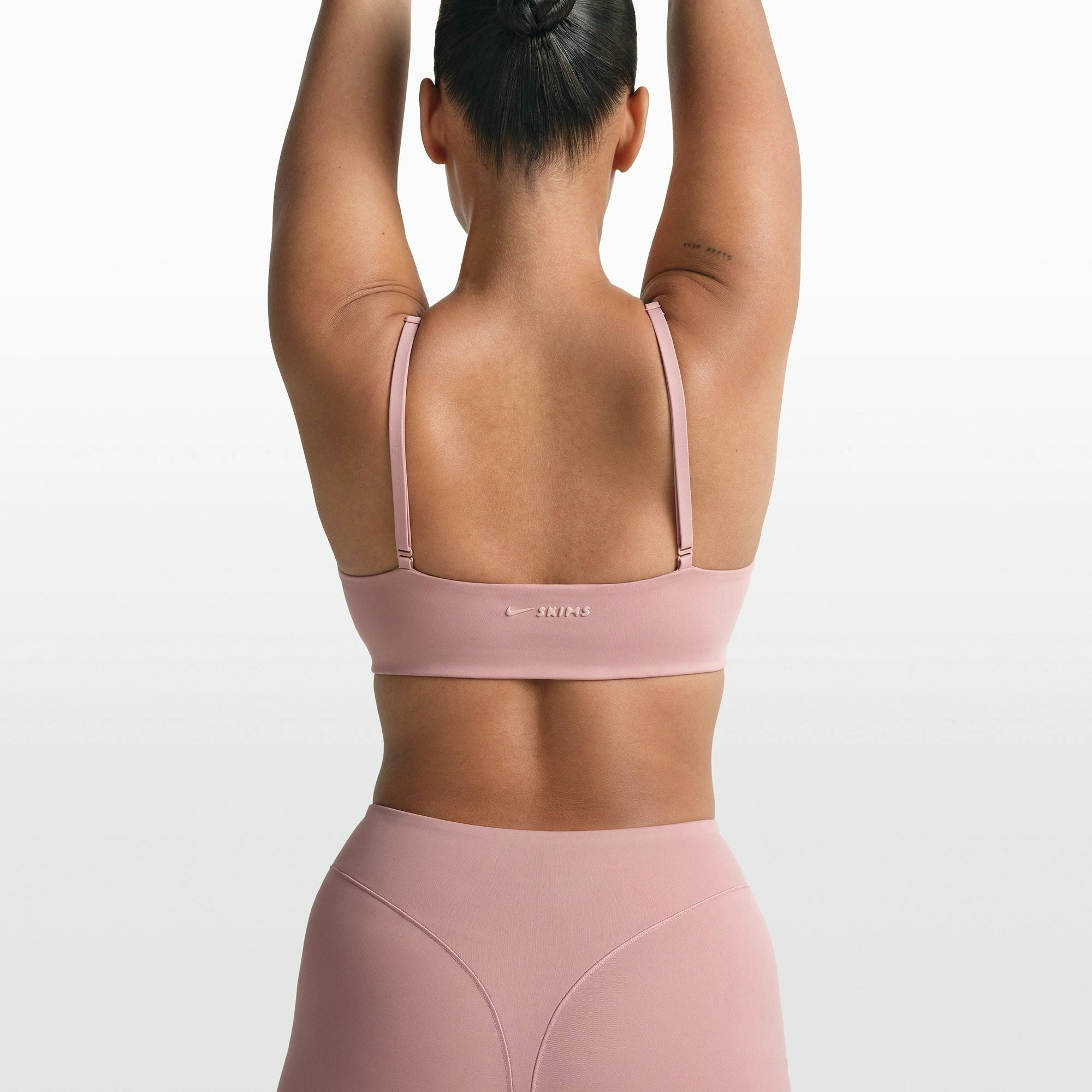 NikeSKIMS MATTE MICRO SCOOP BRA | HIMALAYAN ON A MODEL FRONT VIEW @ | FOCUS: 0.0, 1.0, 0.9