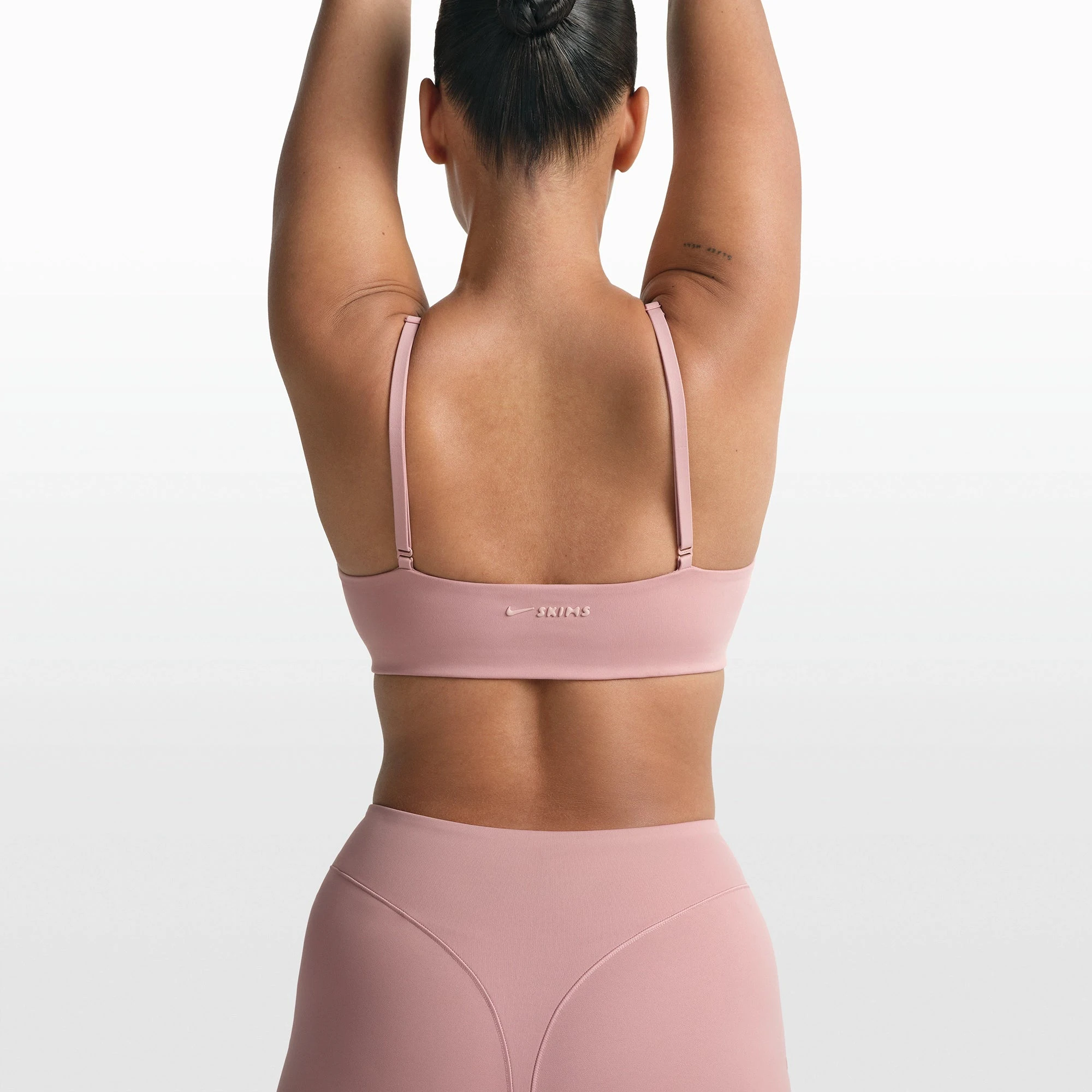 NikeSKIMS MATTE MICRO SCOOP BRA | HIMALAYAN ON A MODEL FRONT VIEW @ | FOCUS: 0.0, 1.0, 0.9