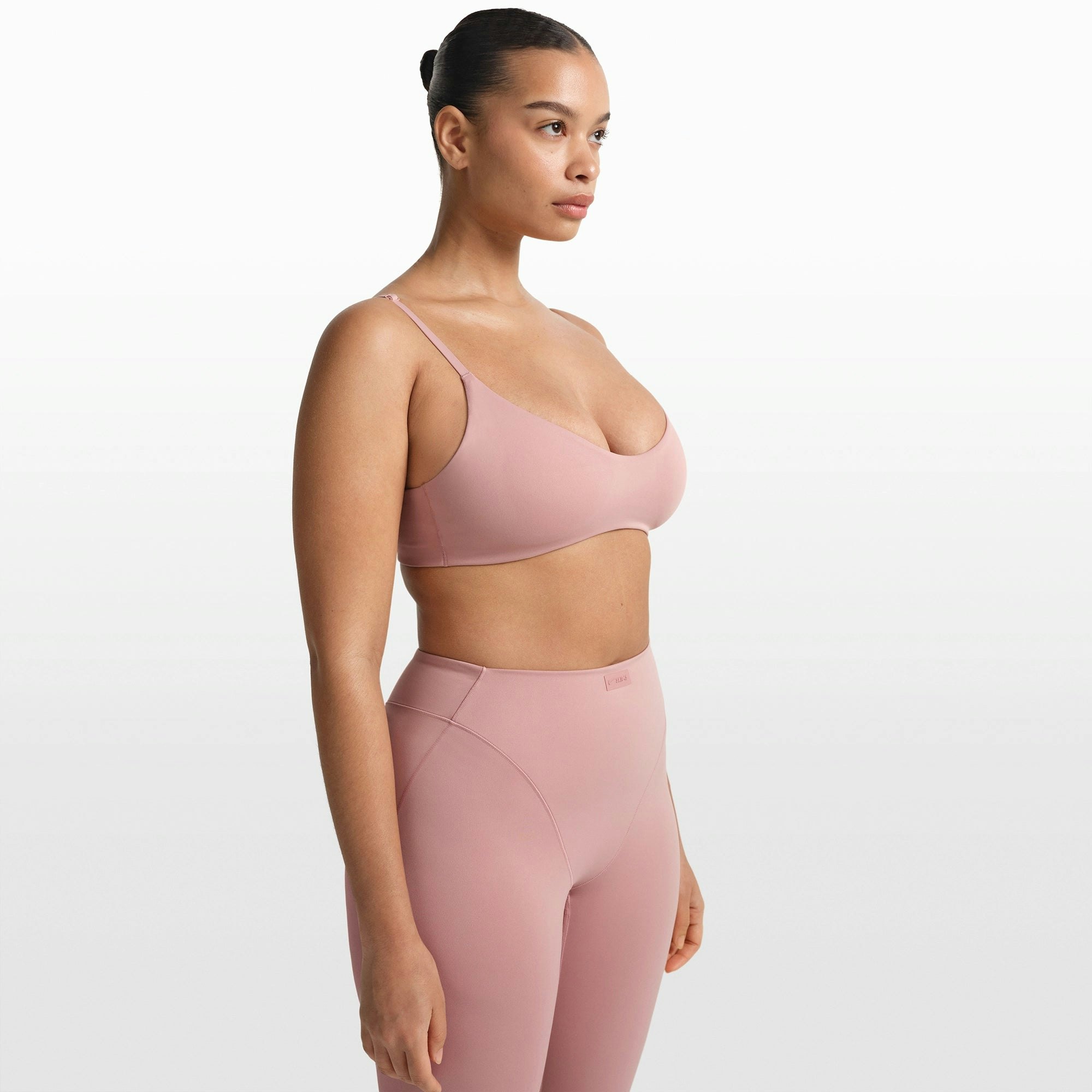 NikeSKIMS MATTE MICRO SCOOP BRA | HIMALAYAN ON A MODEL FRONT VIEW @ | FOCUS: 0.0, 1.0, 0.9