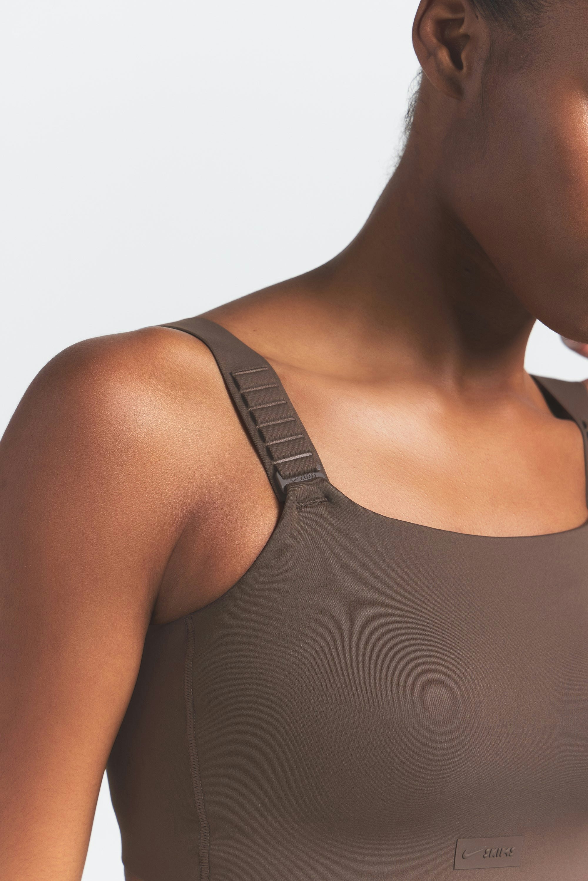 NikeSKIMS MATTE WIDE STRAP BRA | DARK SEPIA ON A MODEL FRONT VIEW