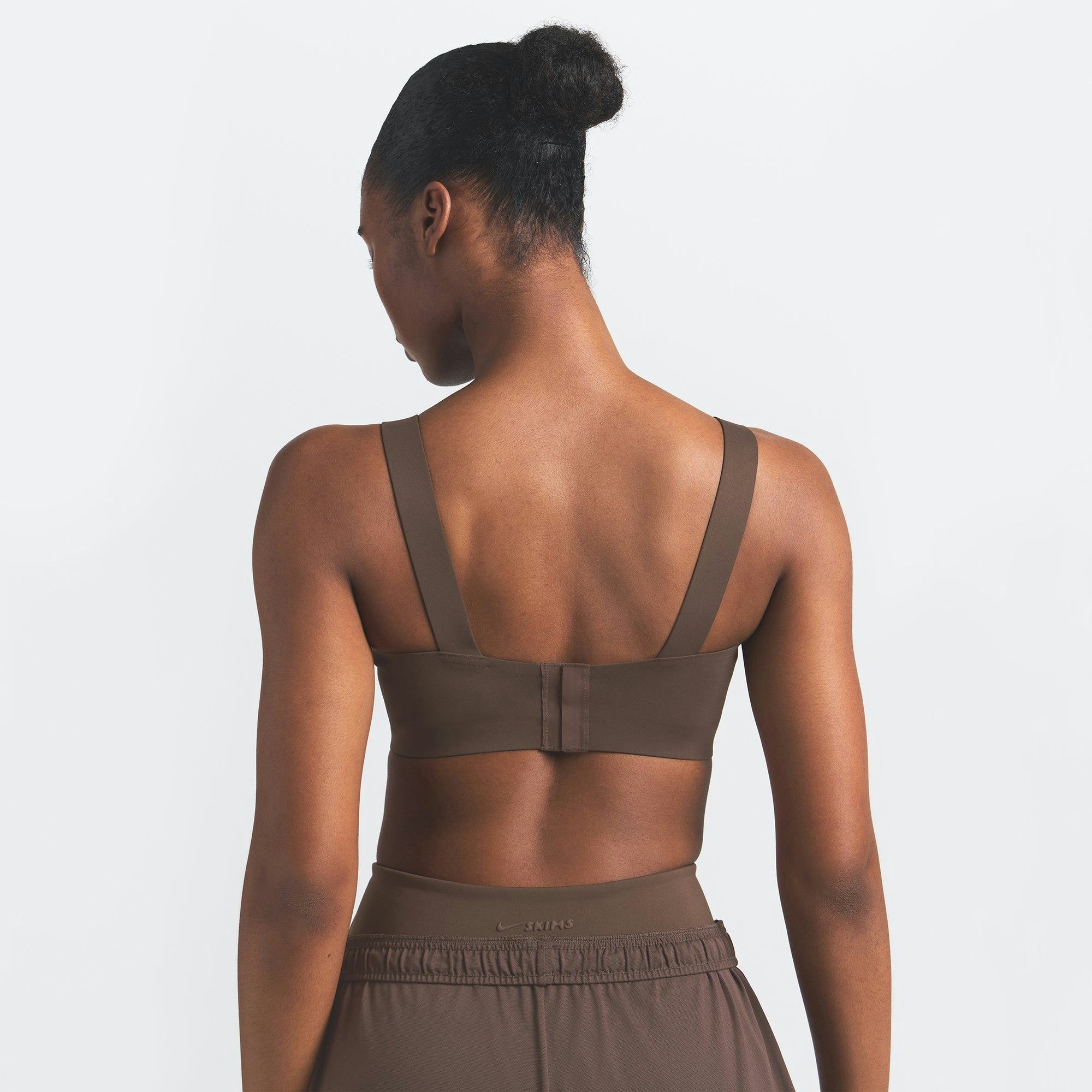 NikeSKIMS MATTE WIDE STRAP BRA | DARK SEPIA ON A MODEL BACK VIEW