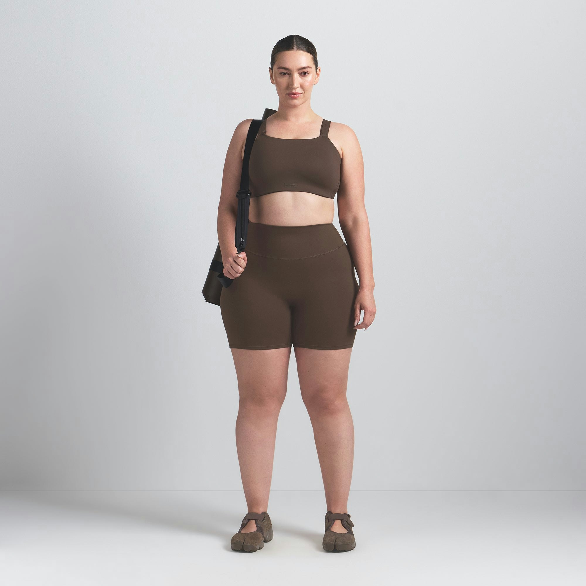 NikeSKIMS MATTE WIDE STRAP BRA | DARK SEPIA ON A MODEL FRONT VIEW