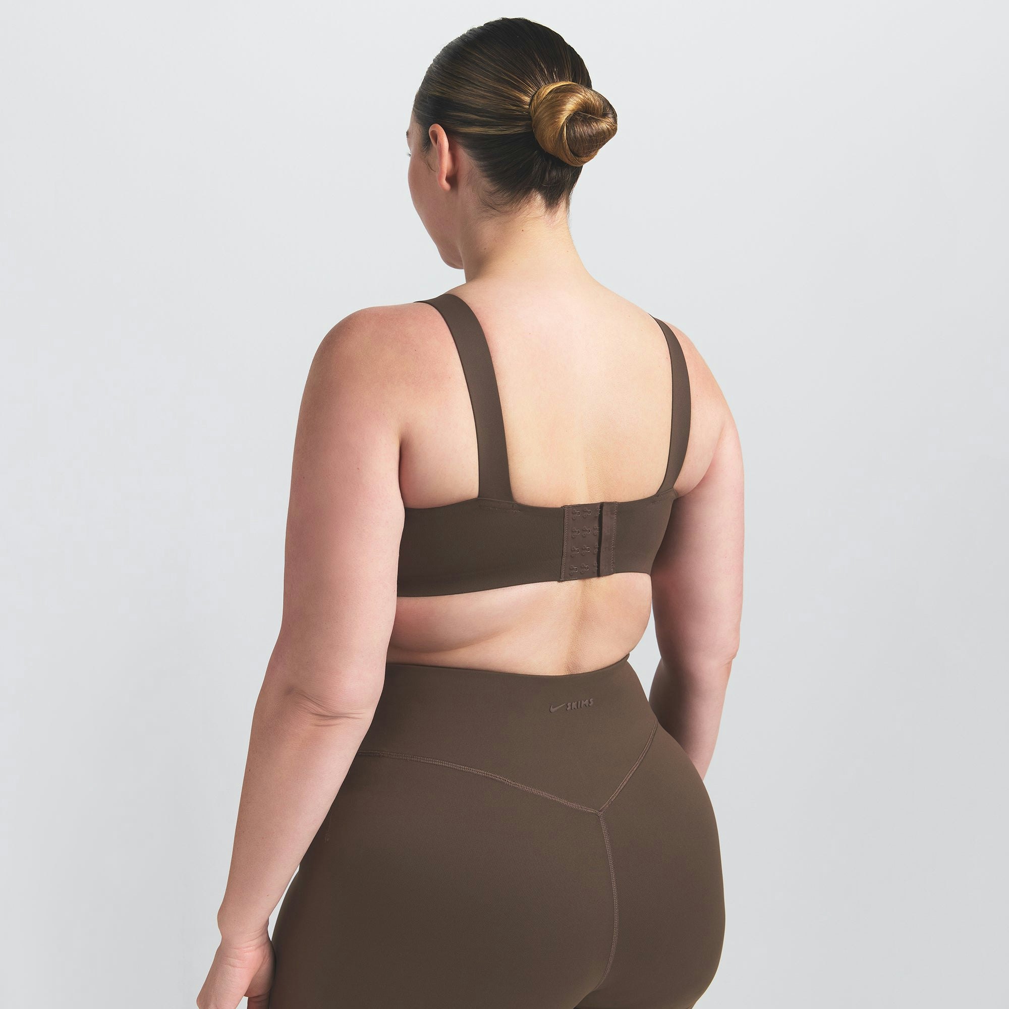 NikeSKIMS MATTE WIDE STRAP BRA | DARK SEPIA ON A MODEL BACK VIEW