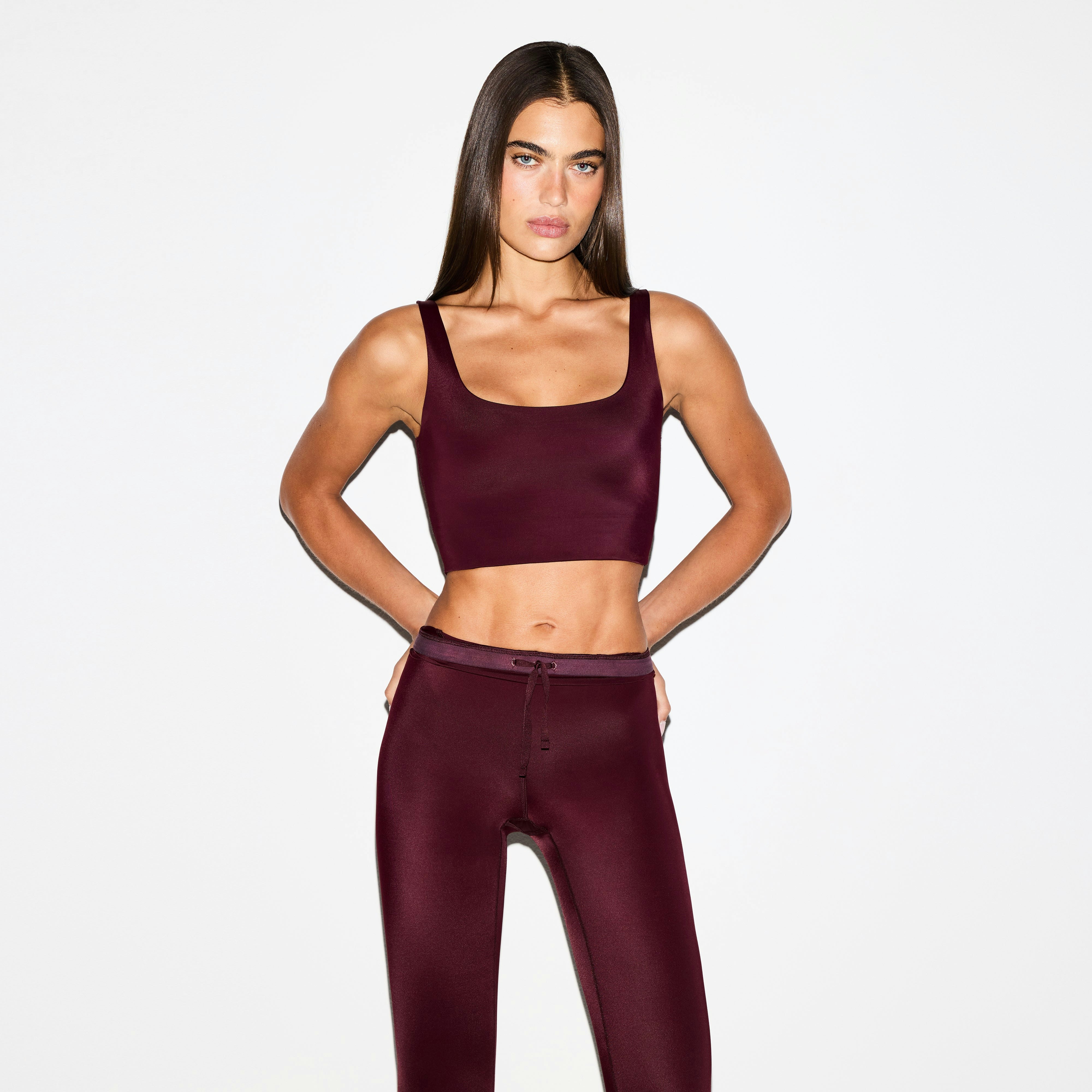 NikeSKIMS SHINE SCOOP NECK BRA TOP | CURRANT ON A MODEL FRONT VIEW @ | FOCUS: 0.0, 1.0, 0.9