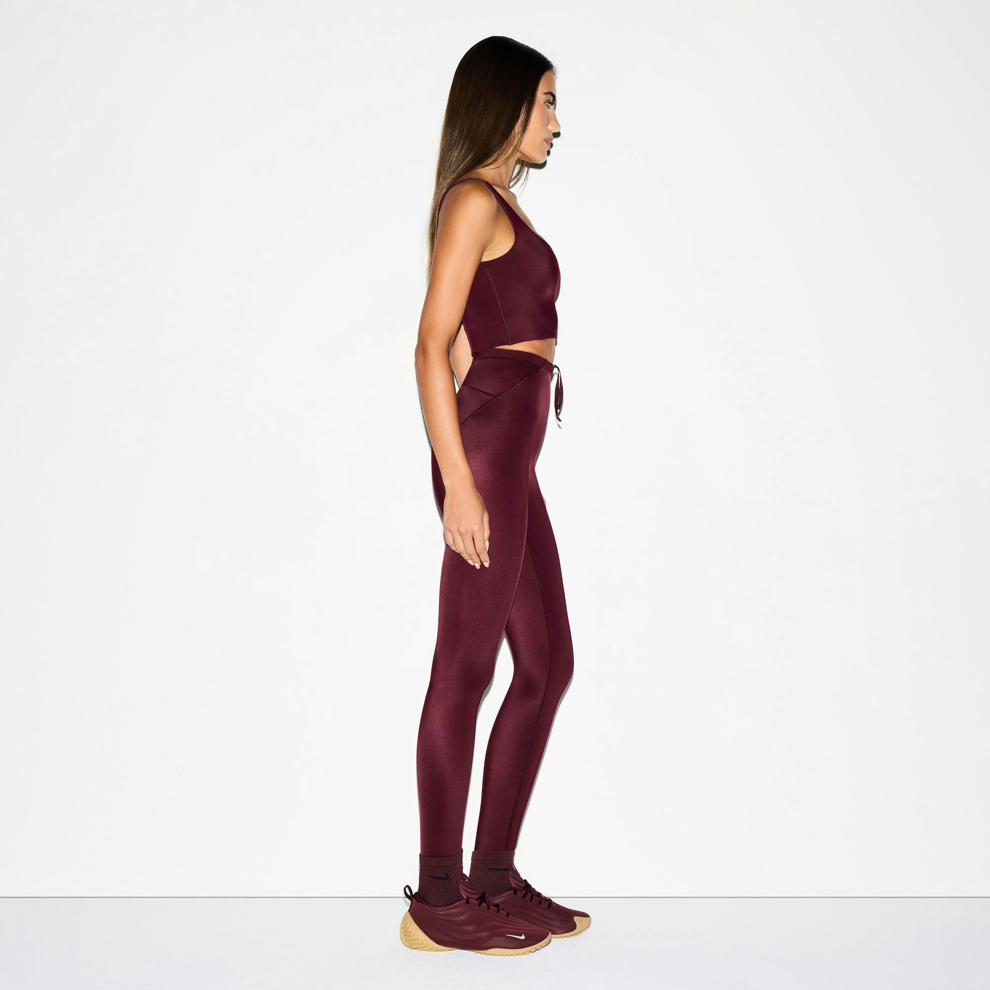 NikeSKIMS SHINE SCOOP NECK BRA TOP | CURRANT ON A MODEL FRONT VIEW @ | FOCUS: 0.0, 1.0, 0.9