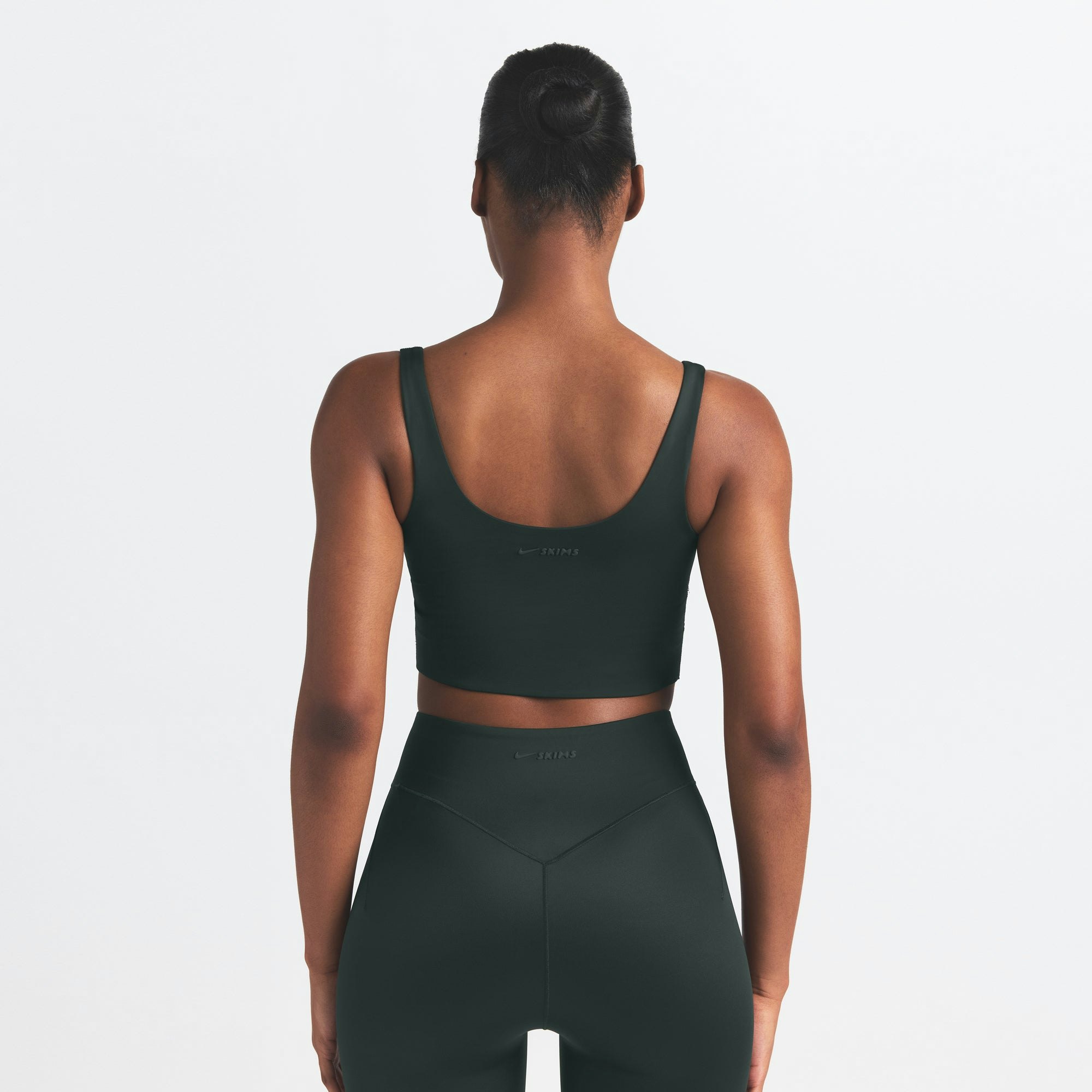 NikeSKIMS SHINE SCOOP NECK BRA TOP | DARK TEAL ON A MODEL SIDE VIEW @ | FOCUS: 0.0, 1.0, 0.9