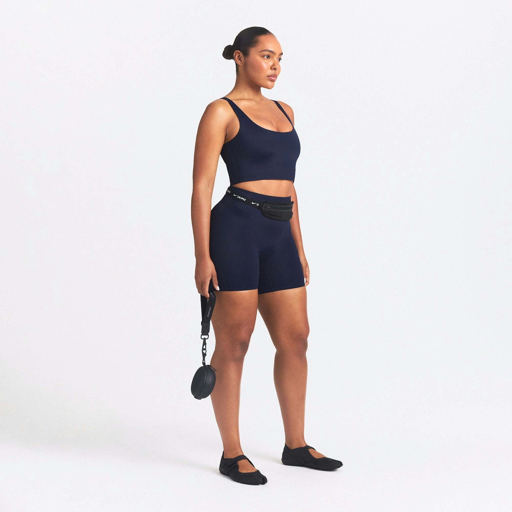 NikeSKIMS SHINE SCOOP NECK BRA TOP | NAVY ON A MODEL SIDE VIEW @ | FOCUS: 0.0, 1.0, 0.9