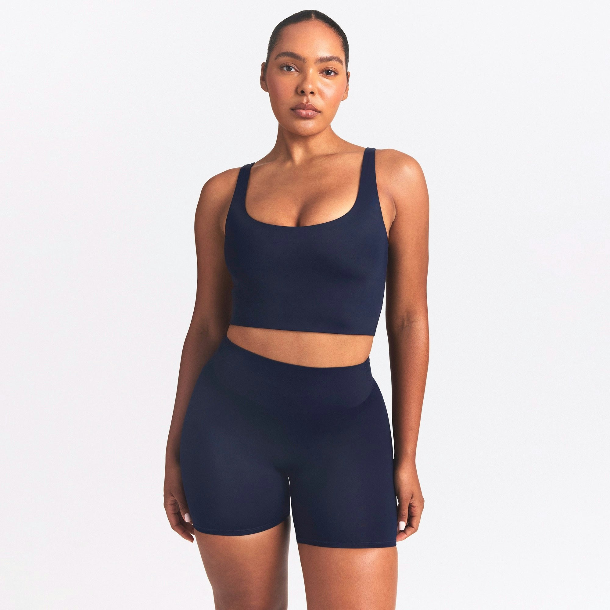 NikeSKIMS SHINE SCOOP NECK BRA TOP | NAVY ON A MODEL SIDE VIEW @ | FOCUS: 0.0, 1.0, 0.9
