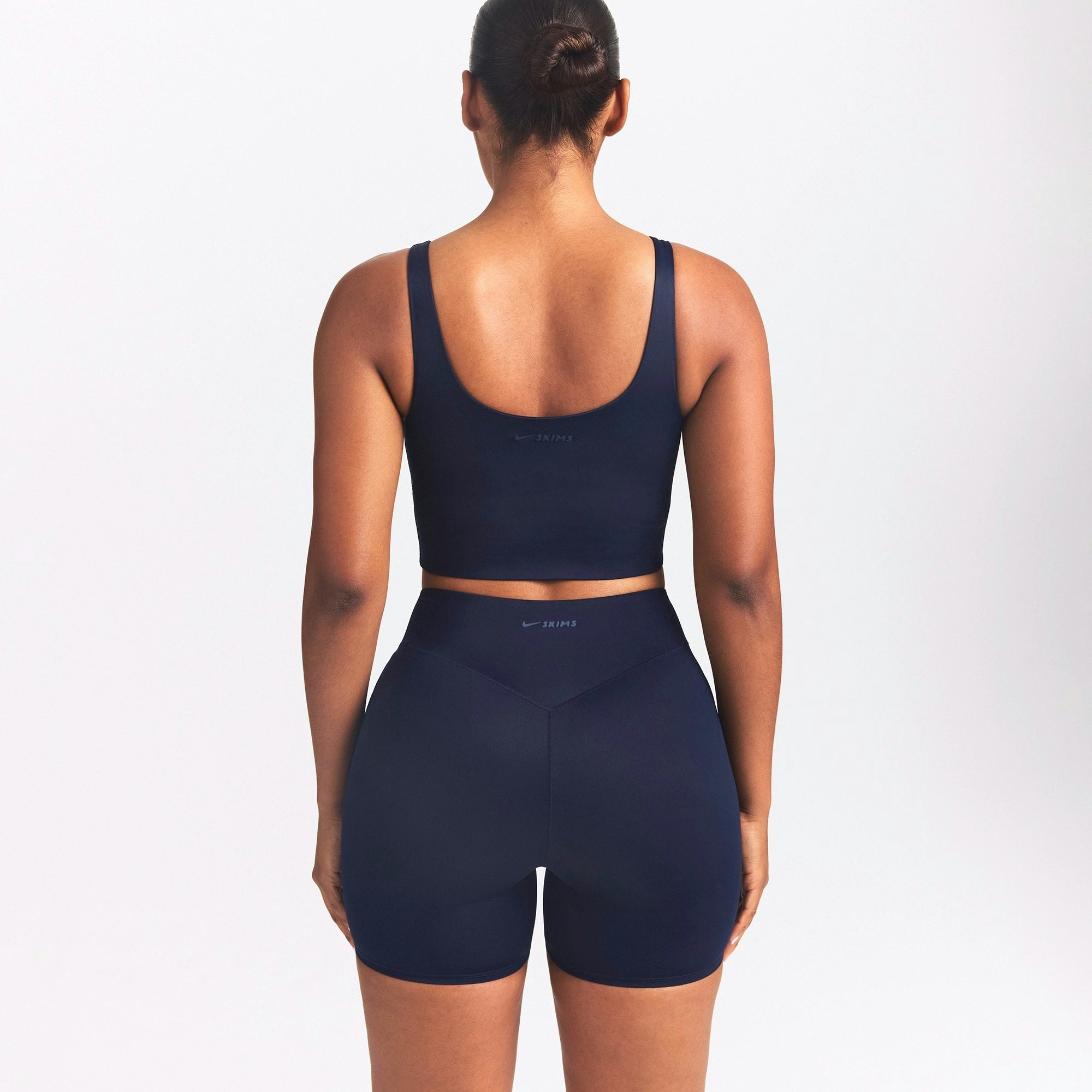 NikeSKIMS SHINE SCOOP NECK BRA TOP | NAVY ON A MODEL SIDE VIEW @ | FOCUS: 0.0, 1.0, 0.9