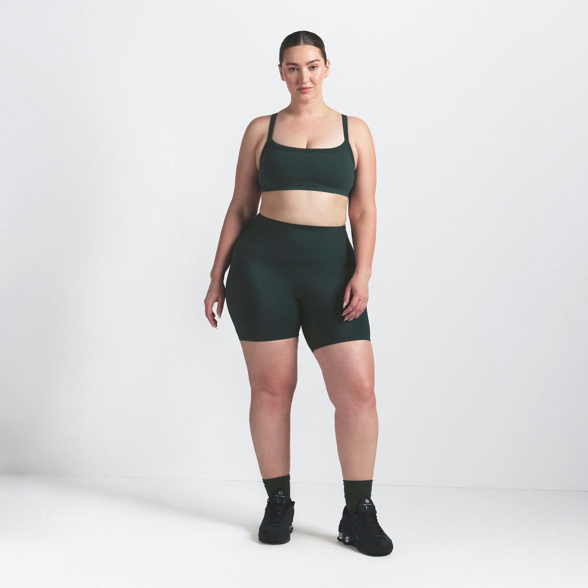 NikeSKIMS VINTAGE SEAMLESS CAMI BRA | DARK TEAL ON A MODEL FRONT VIEW @ | FOCUS: 0.0, 1.0, 0.9