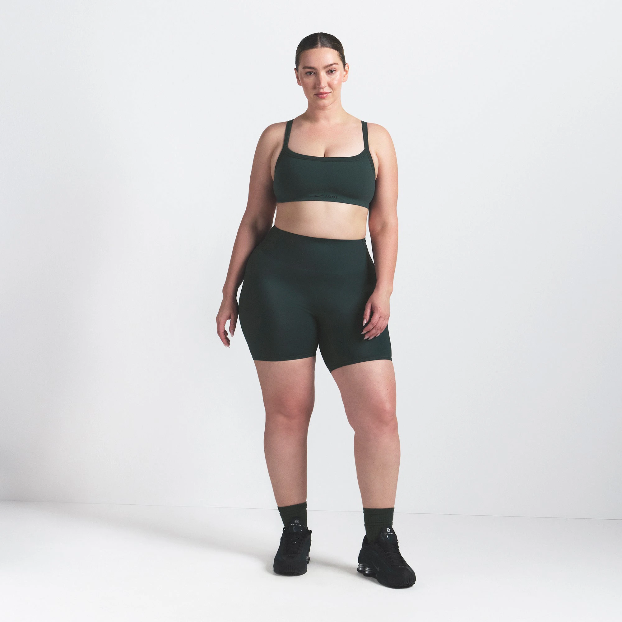 NikeSKIMS VINTAGE SEAMLESS CAMI BRA | DARK TEAL ON A MODEL FRONT VIEW @ | FOCUS: 0.0, 1.0, 0.9