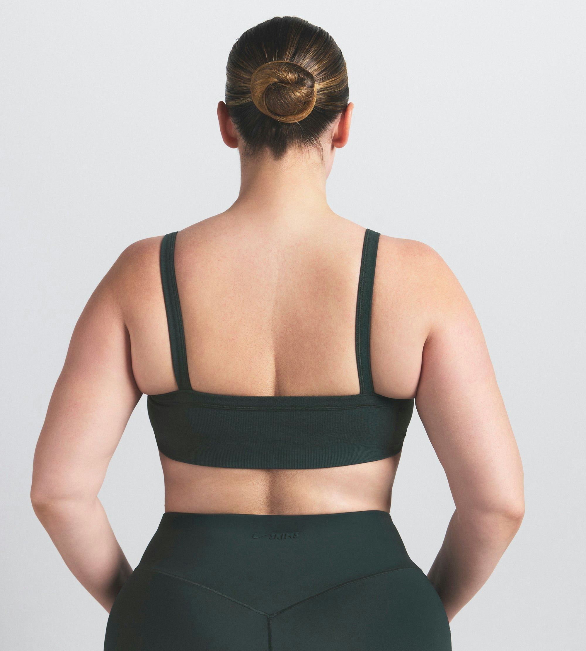 NikeSKIMS VINTAGE SEAMLESS CAMI BRA | DARK TEAL ON A MODEL SIDE VIEW @ | FOCUS: 0.0, 1.0, 0.9