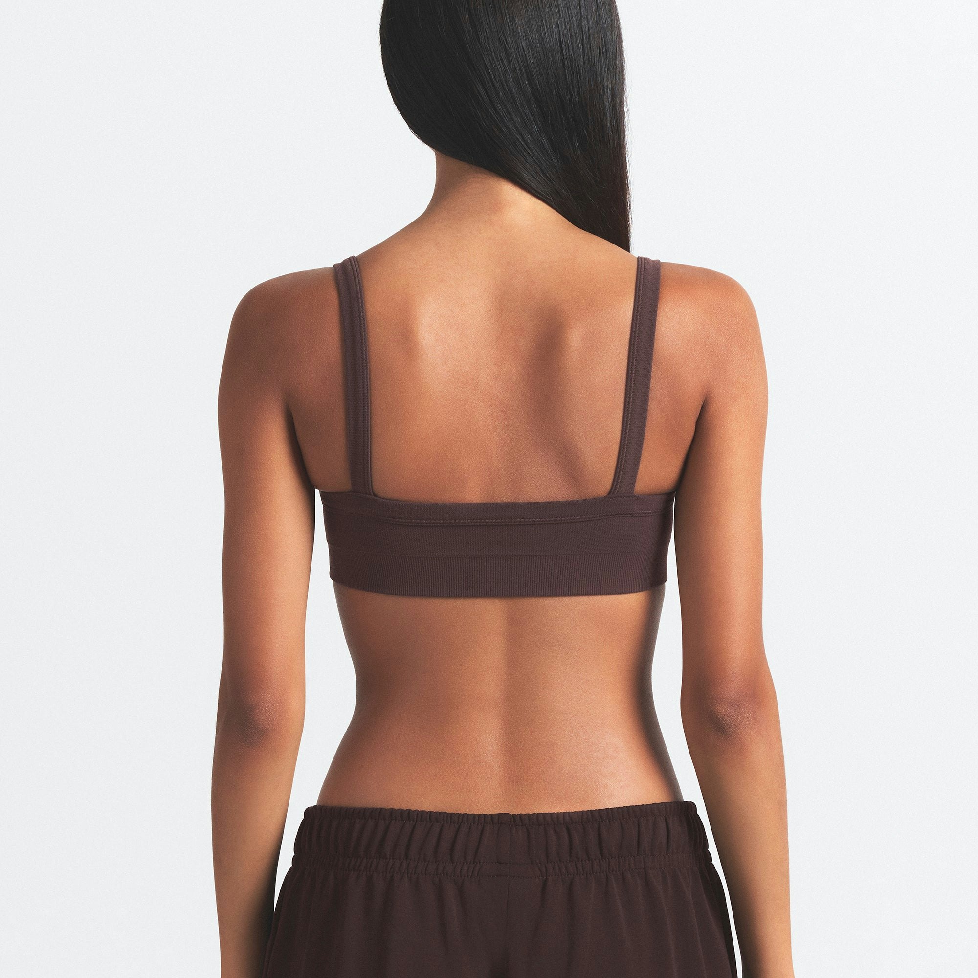 NikeSKIMS VINTAGE SEAMLESS CAMI BRA | PHOENIX ON A MODEL SIDE VIEW
