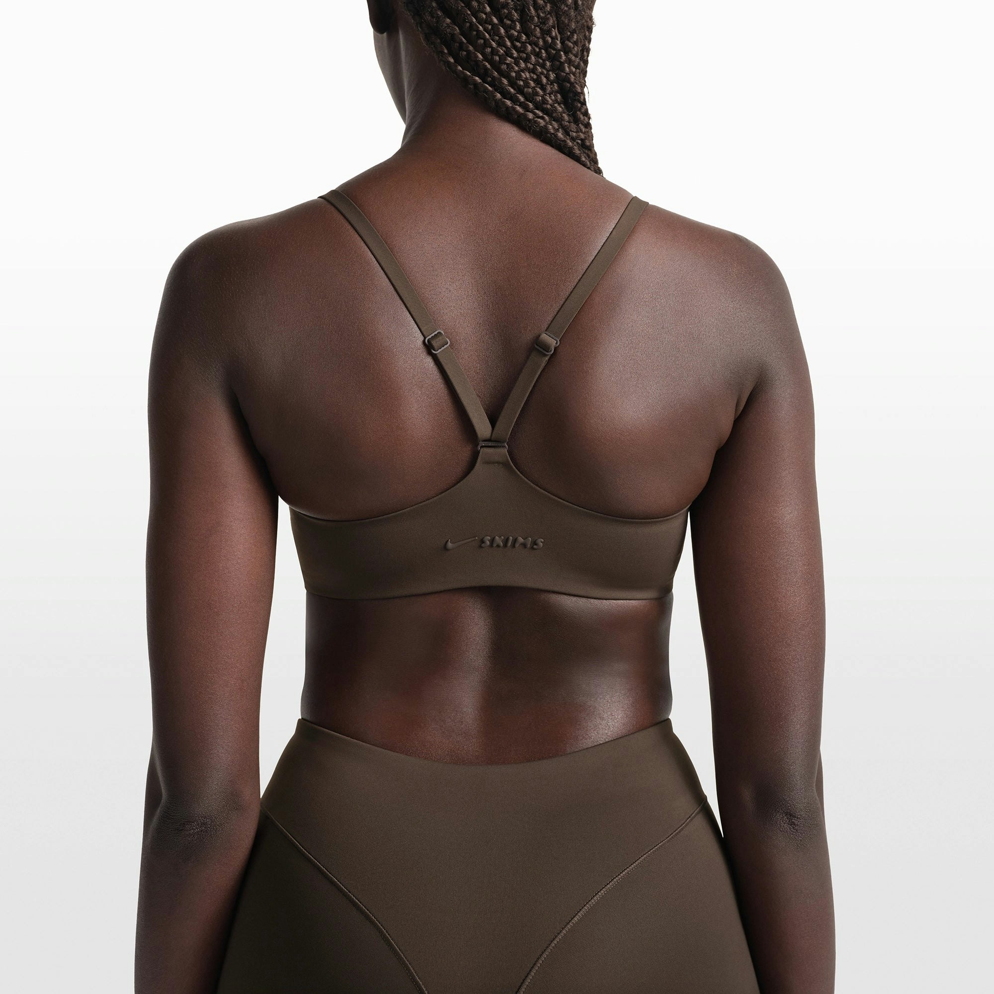 NikeSKIMS MATTE CONTOUR CAMI BRA | DARK SEPIA ON A MODEL FRONT VIEW @ | FOCUS: 0.0, 1.0, 0.9