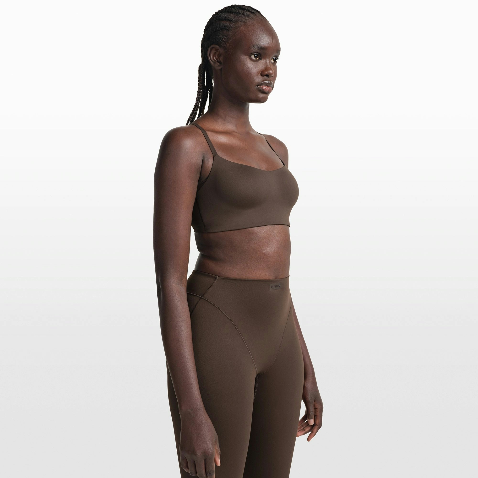 NikeSKIMS MATTE CONTOUR CAMI BRA | DARK SEPIA ON A MODEL FRONT VIEW @ | FOCUS: 0.0, 1.0, 0.9