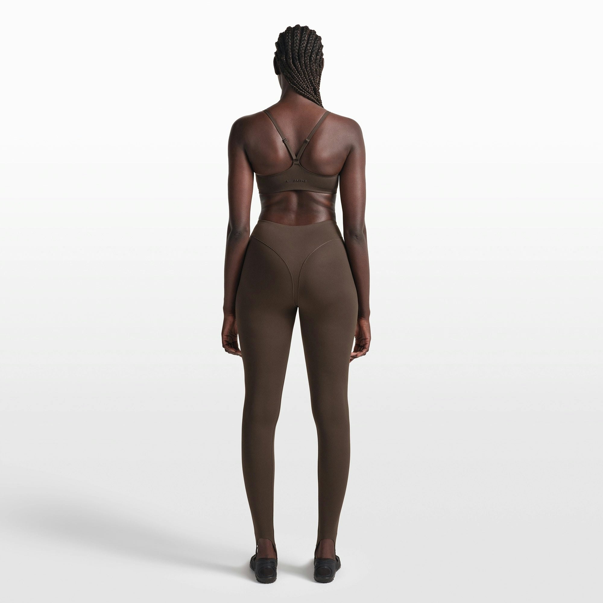 NikeSKIMS MATTE CONTOUR CAMI BRA | DARK SEPIA ON A MODEL FRONT VIEW @ | FOCUS: 0.0, 1.0, 0.9