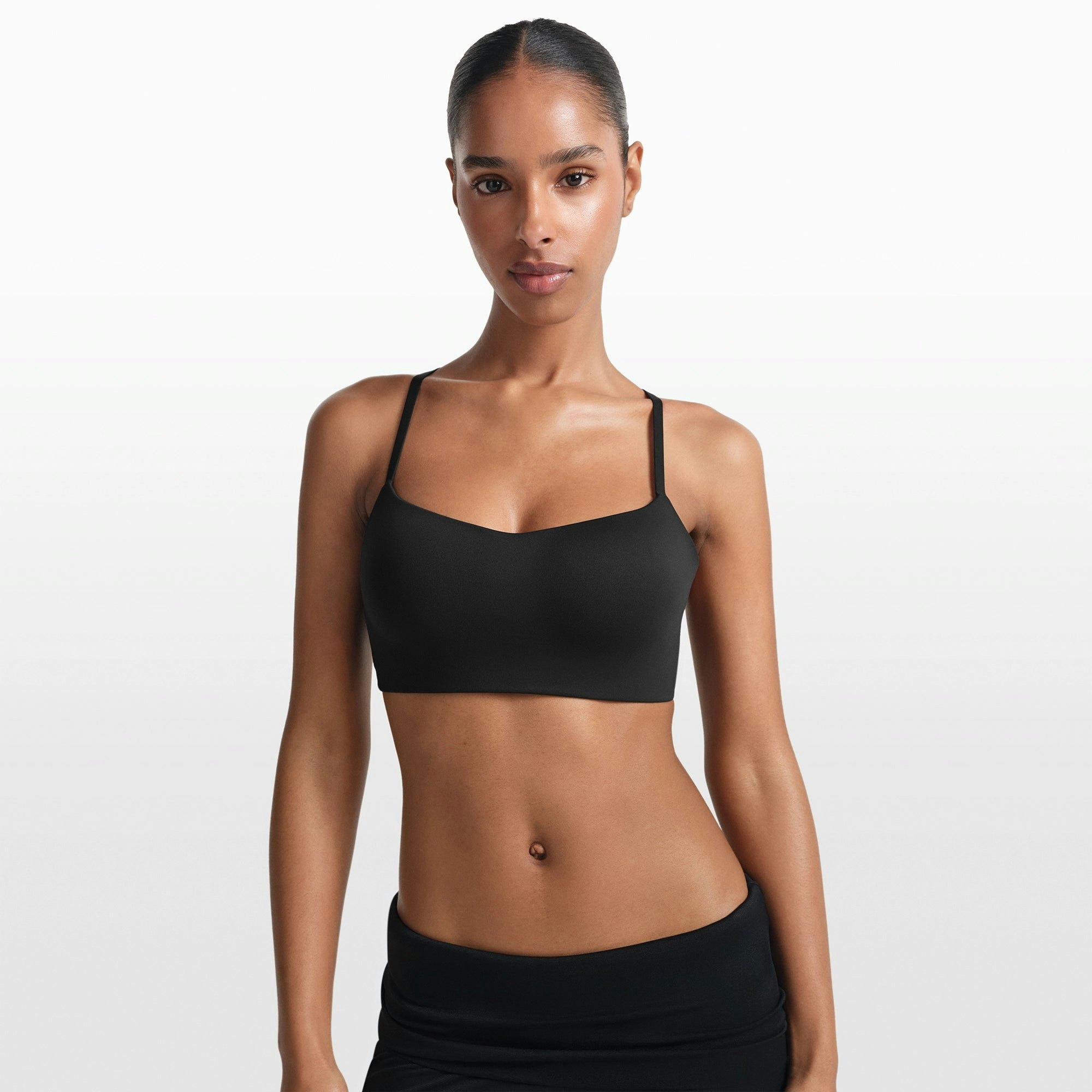 NikeSKIMS MATTE CONTOUR CAMI BRA | OBSIDIAN ON A MODEL FRONT VIEW @ | FOCUS: 0.0, 1.0, 0.9