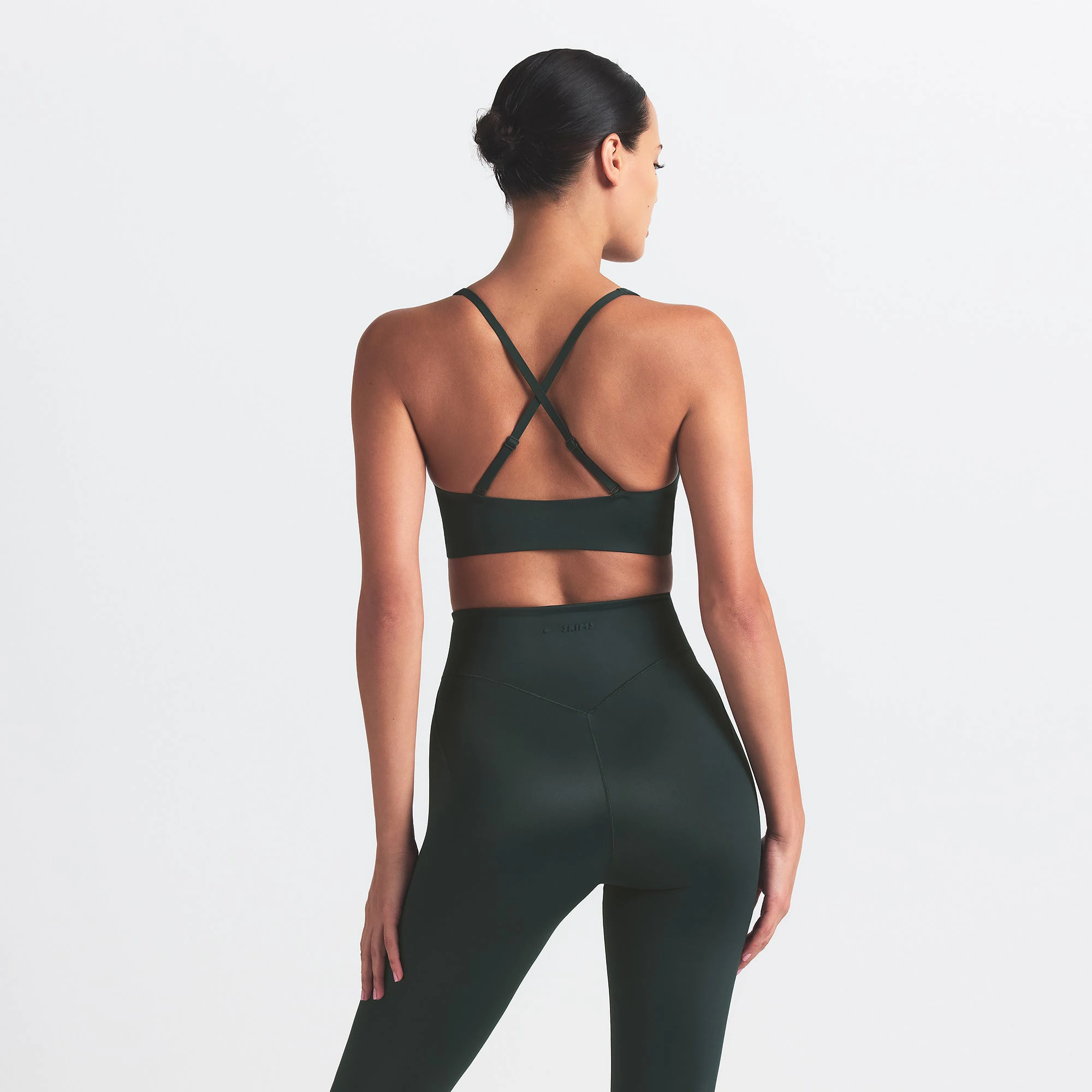 NikeSKIMS SHINE V-NECK BRA | DARK TEAL ON A MODEL SIDE VIEW @ | FOCUS: 0.0, 1.0, 0.9