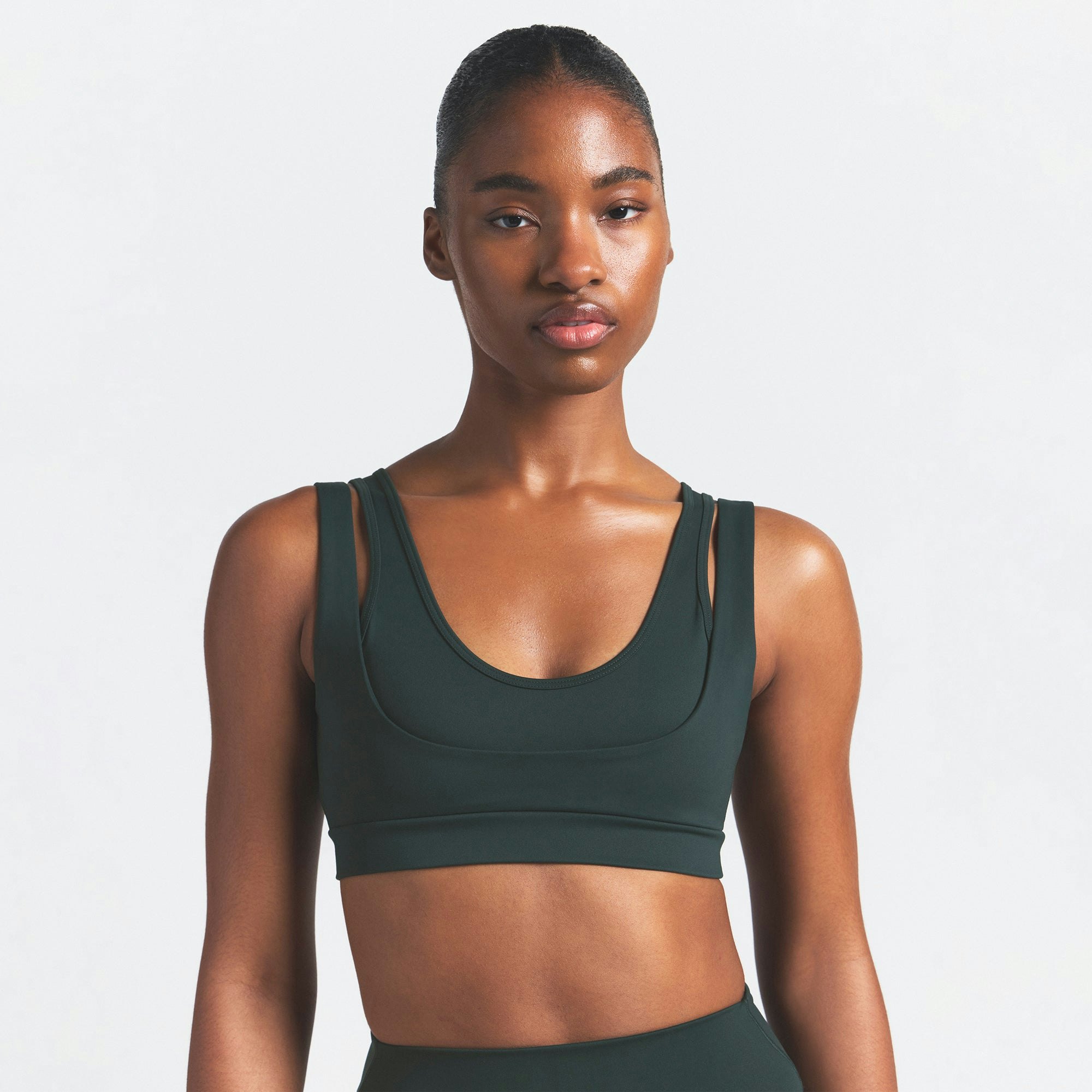 NikeSKIMS MATTE DOUBLE STRAP SCOOP BRA | DARK TEAL ON A MODEL SIDE VIEW @ | FOCUS: 0.0, 1.0, 0.9