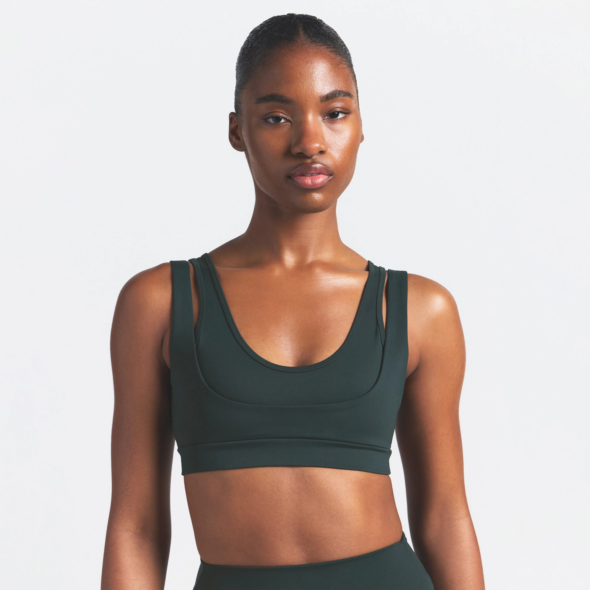 NikeSKIMS MATTE DOUBLE STRAP SCOOP BRA | DARK TEAL ON A MODEL SIDE VIEW @ | FOCUS: 0.0, 1.0, 0.9