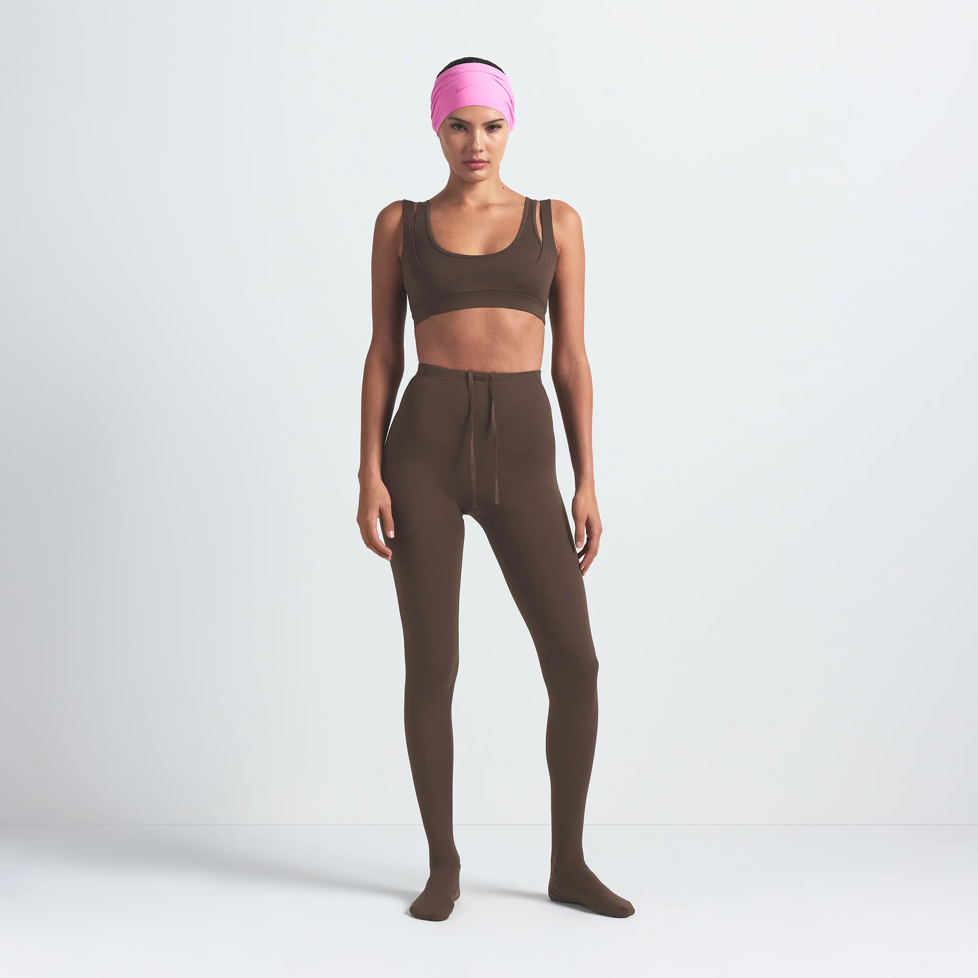NikeSKIMS MATTE DOUBLE STRAP SCOOP BRA | DARK SEPIA ON A MODEL FRONT VIEW @ | FOCUS: 0.9, 0.1, 0.7