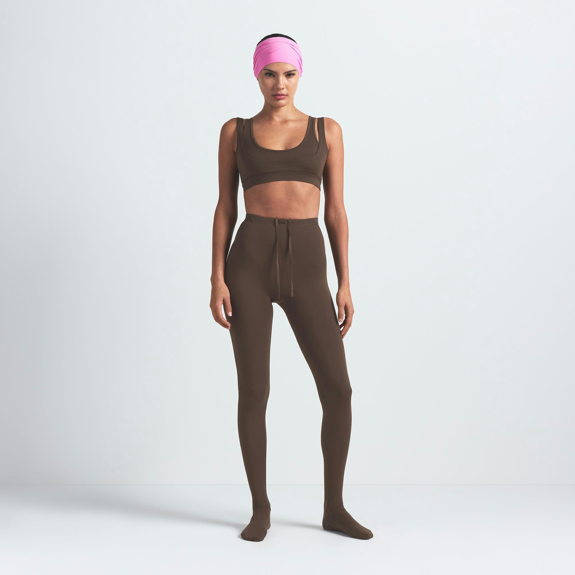 NikeSKIMS MATTE DOUBLE STRAP SCOOP BRA | DARK SEPIA ON A MODEL FRONT VIEW @ | FOCUS: 0.9, 0.1, 0.7